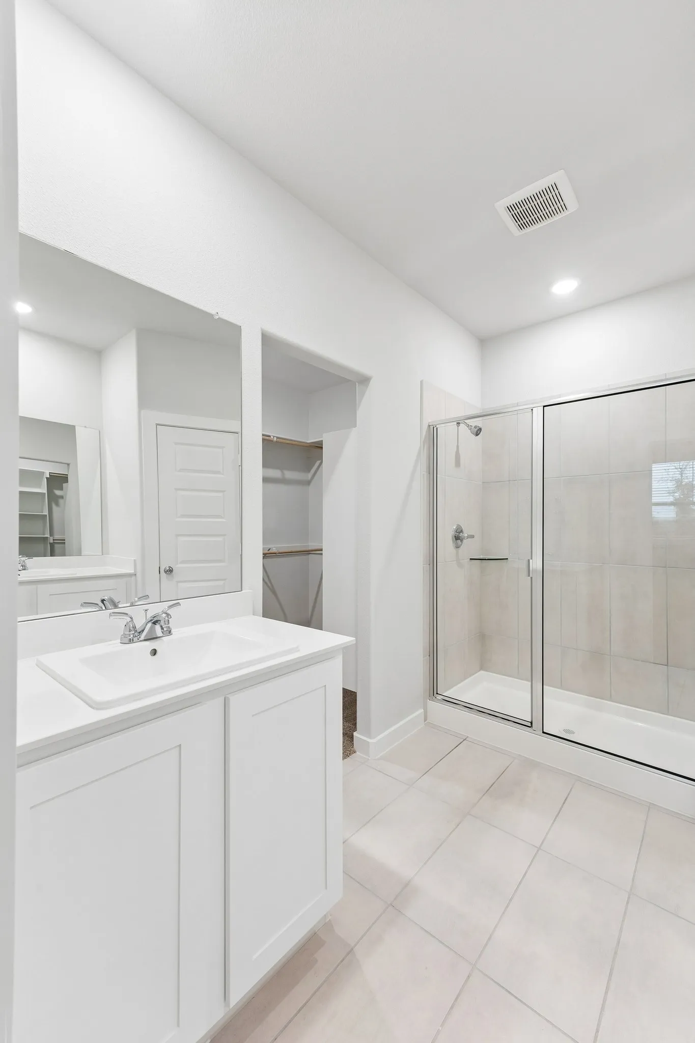Primary Bathroom in the Cedar home plan by Trophy Signature Homes – REPRESENTATIVE PHOTO