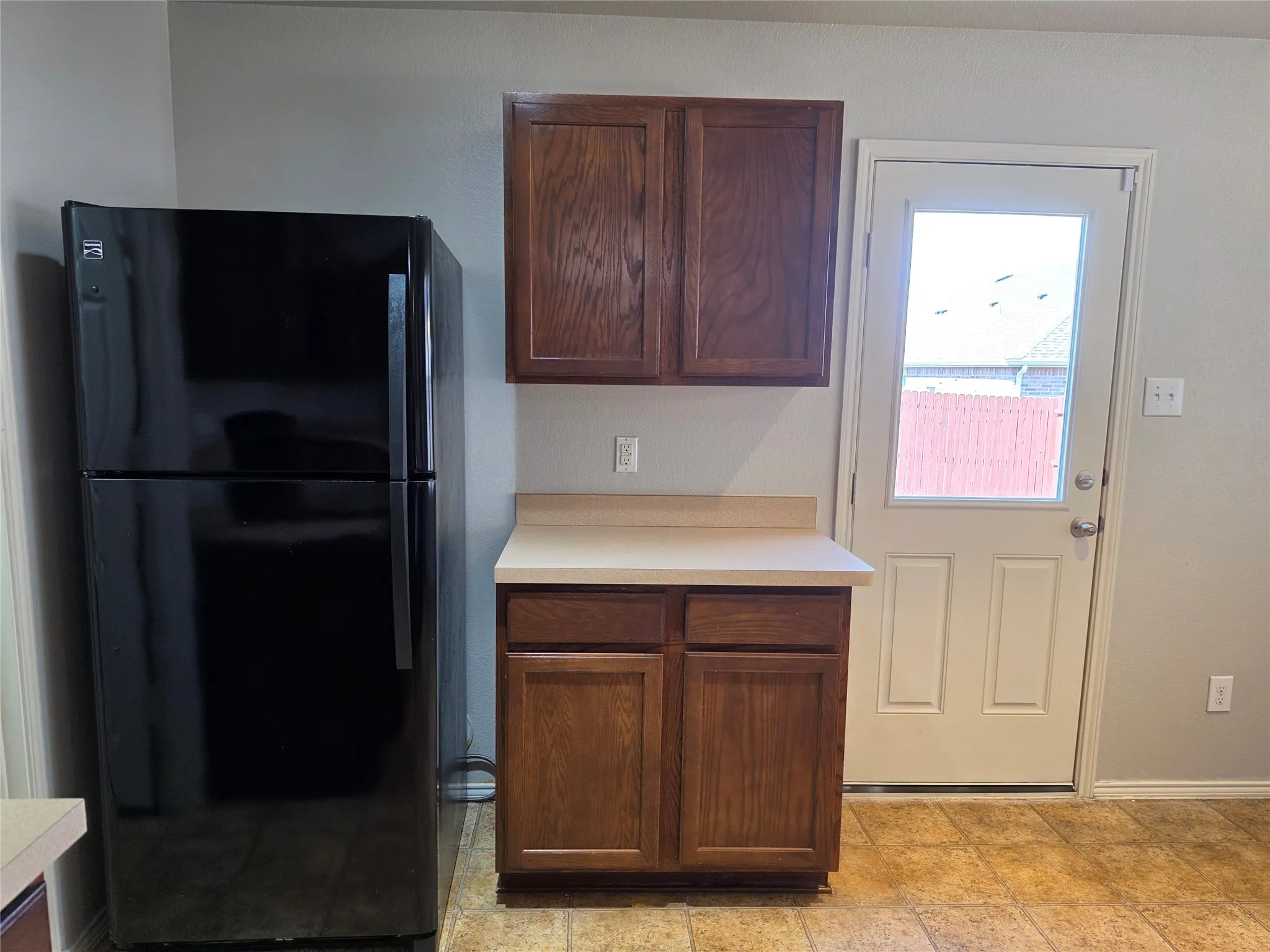 Black Refrigerator with icemaker stays