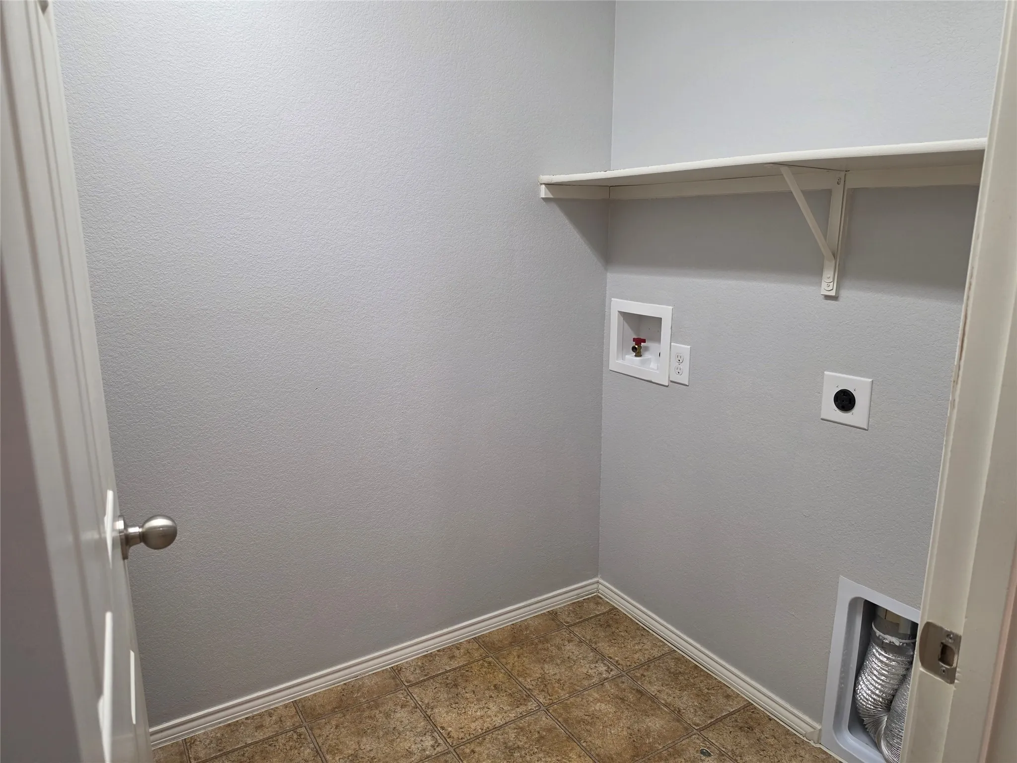 Utility Room holds full size washer and dryer