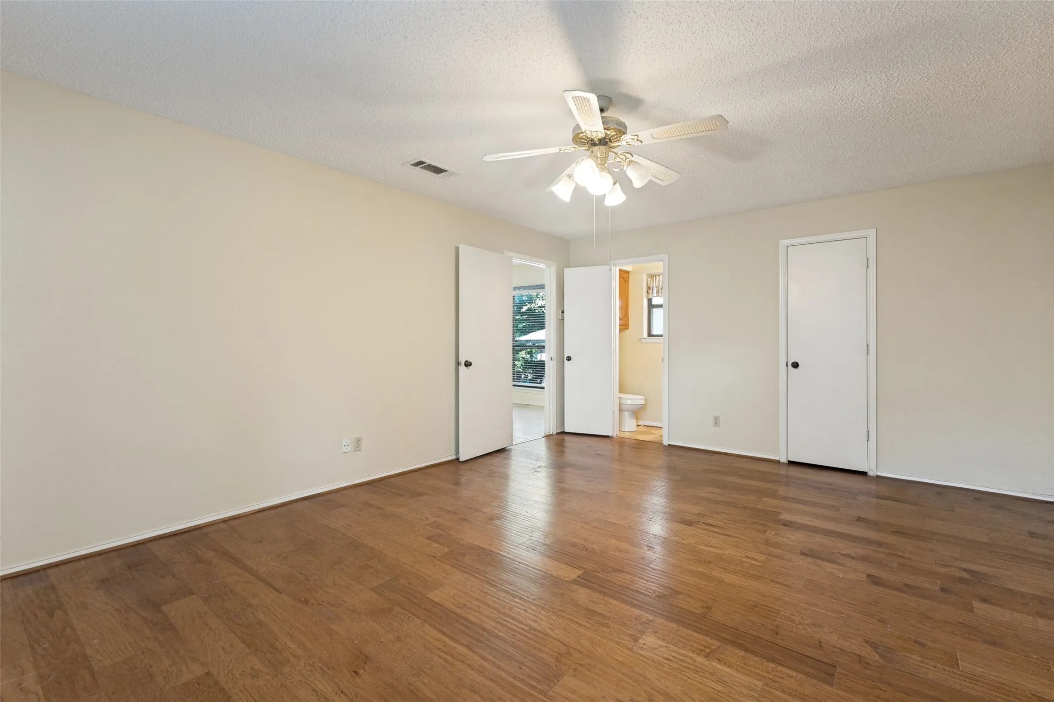 Peek into the half bath from this second living room.