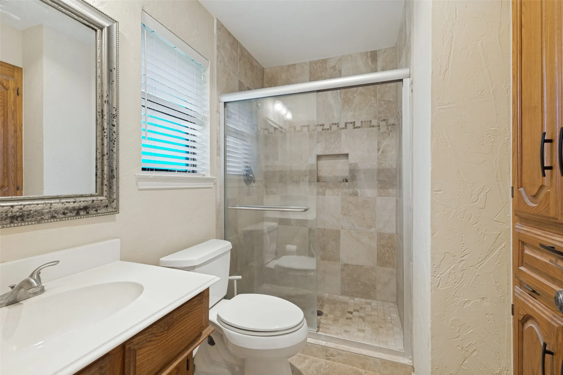Remodeled shower in the primary bathroom.