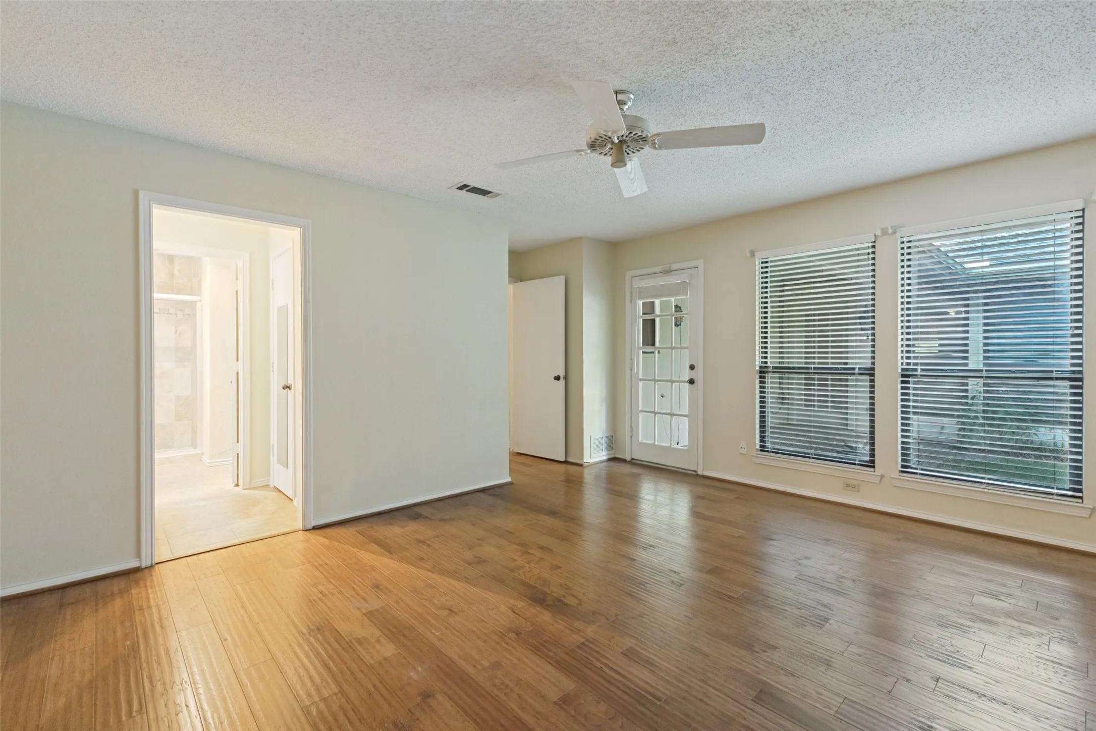 Primary bedroom with access to the backyard.  Lots of natural light!