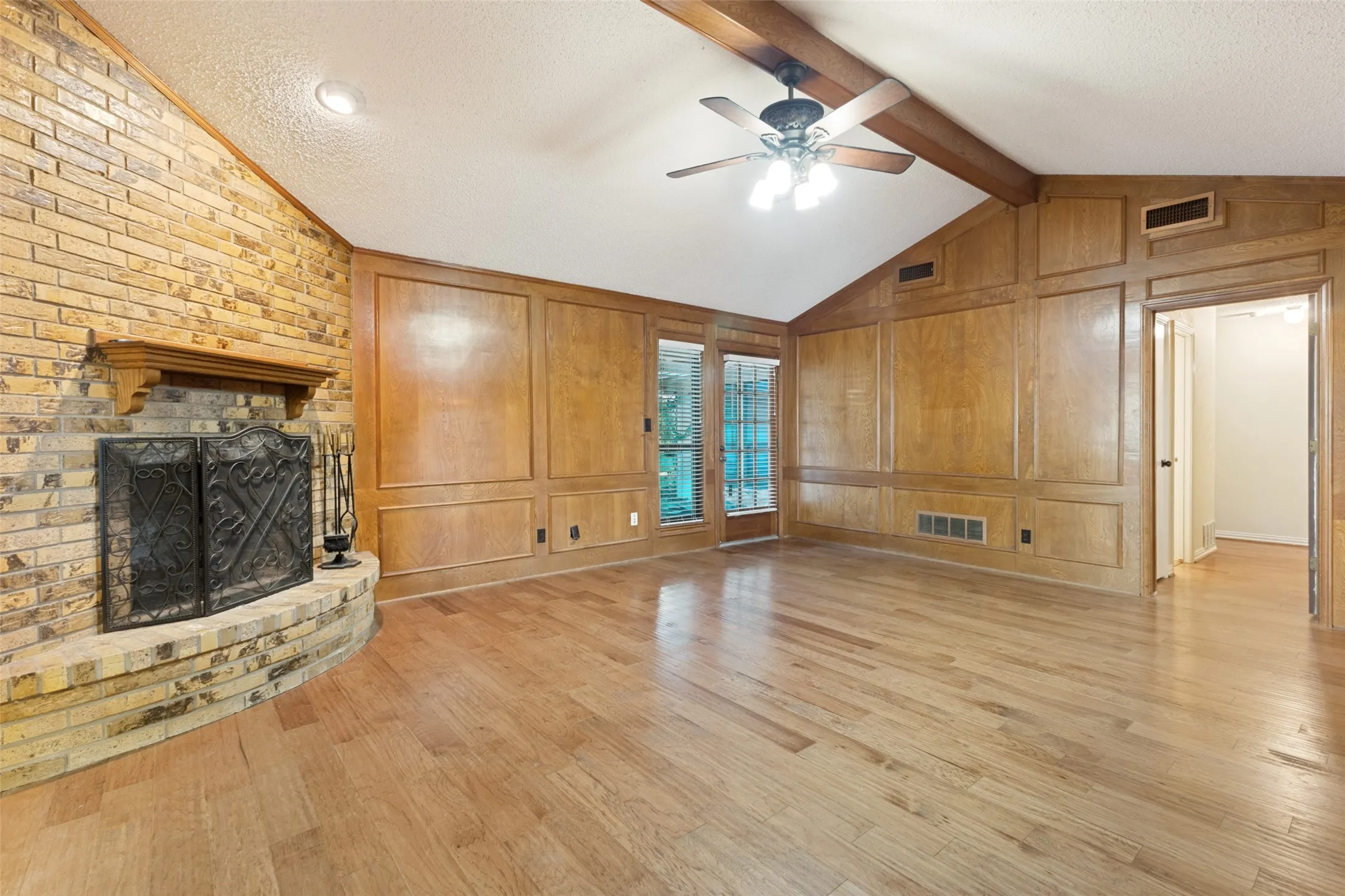 Beautiful wood burning fireplace.  I can almost see the holidays right here with stockings hanging and a tree nearby!
