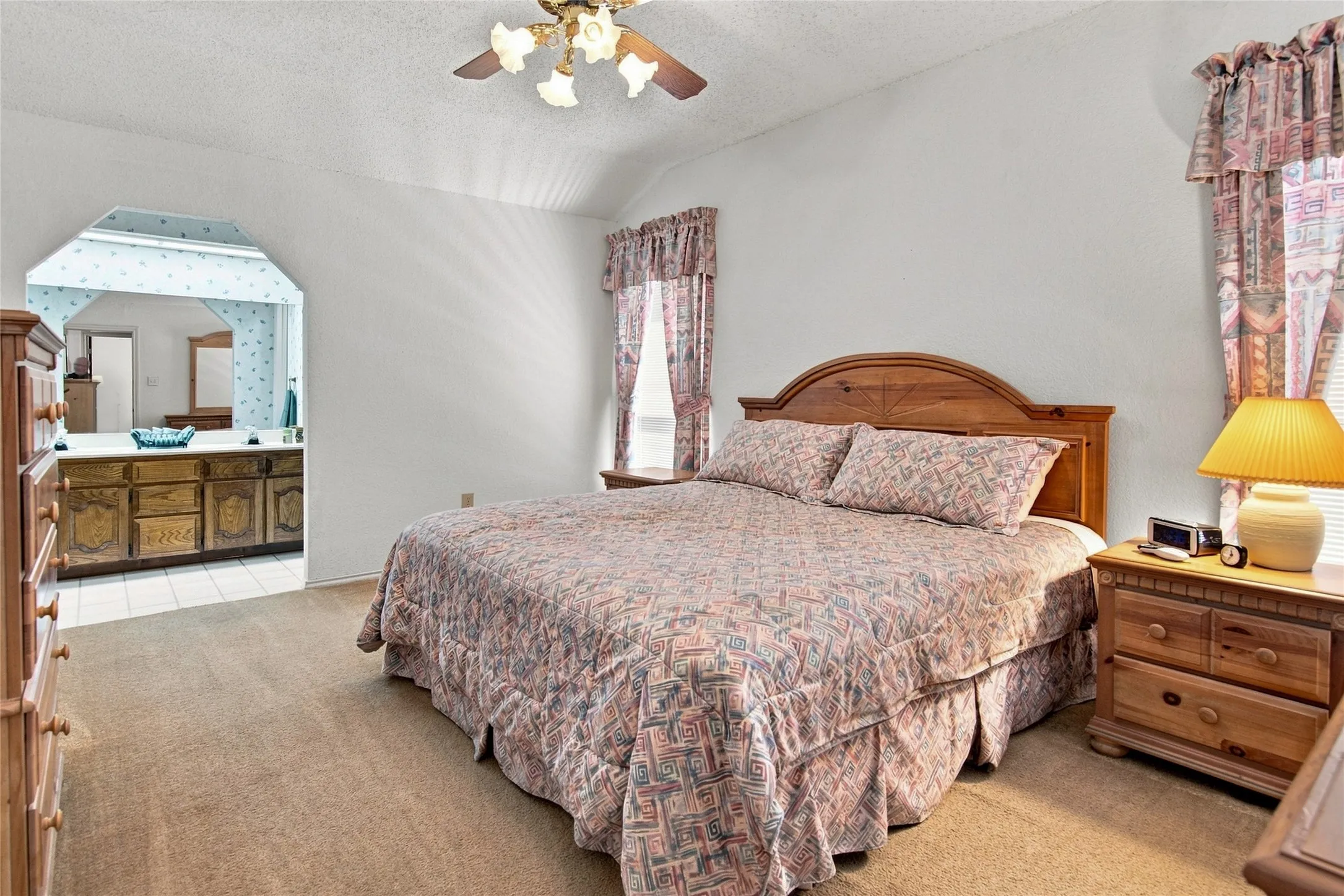 When the day winds down, the primary suite offers