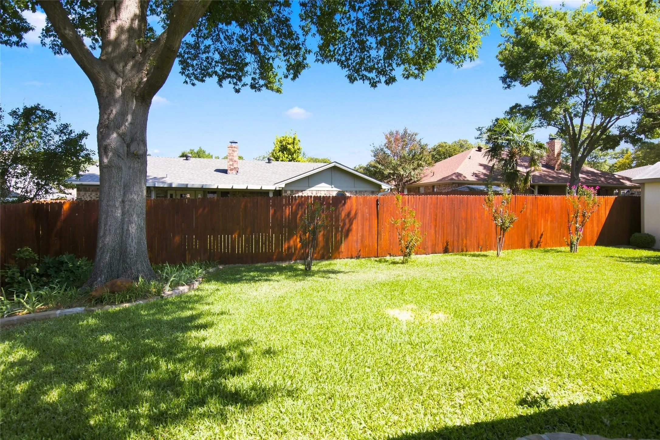 The beautifully landscaped yard creates a peaceful,