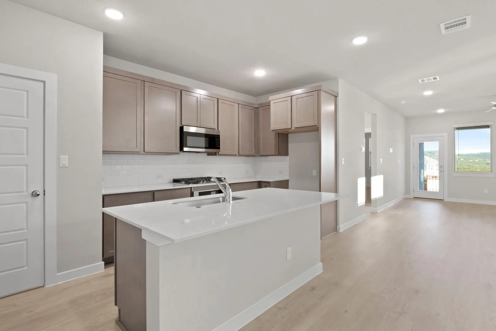 Kitchen in the Willow home plan by Trophy Signature Homes – REPRESENTATIVE PHOTO