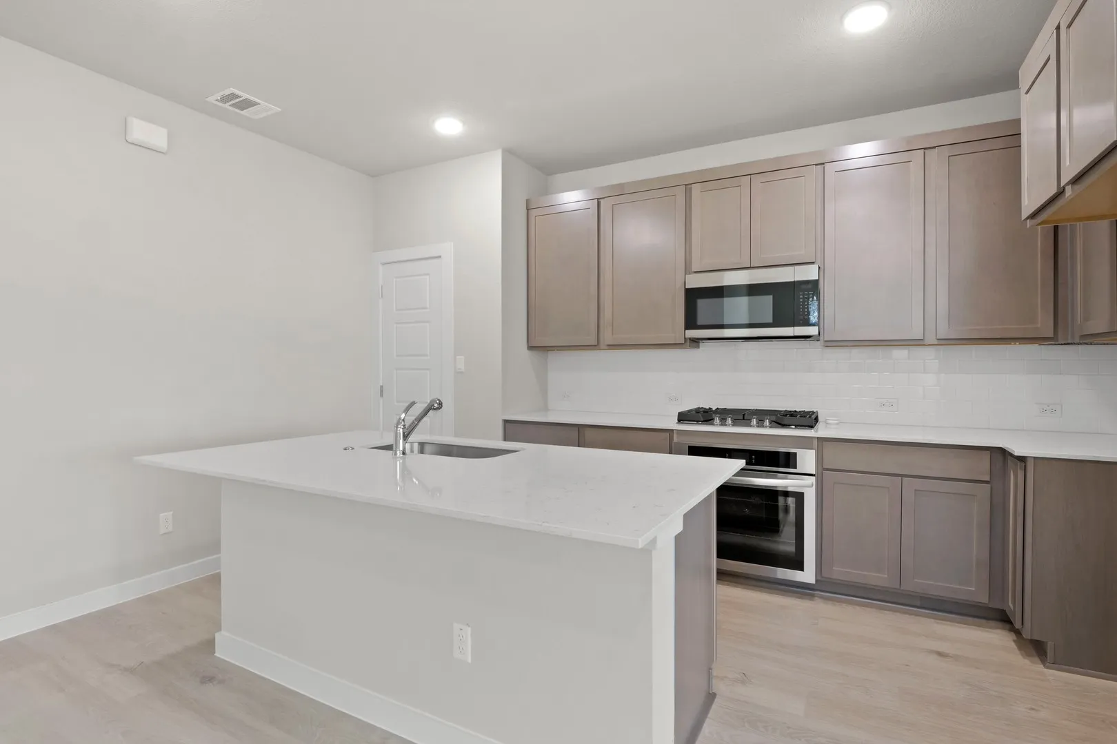 Kitchen in the Willow home plan by Trophy Signature Homes – REPRESENTATIVE PHOTO