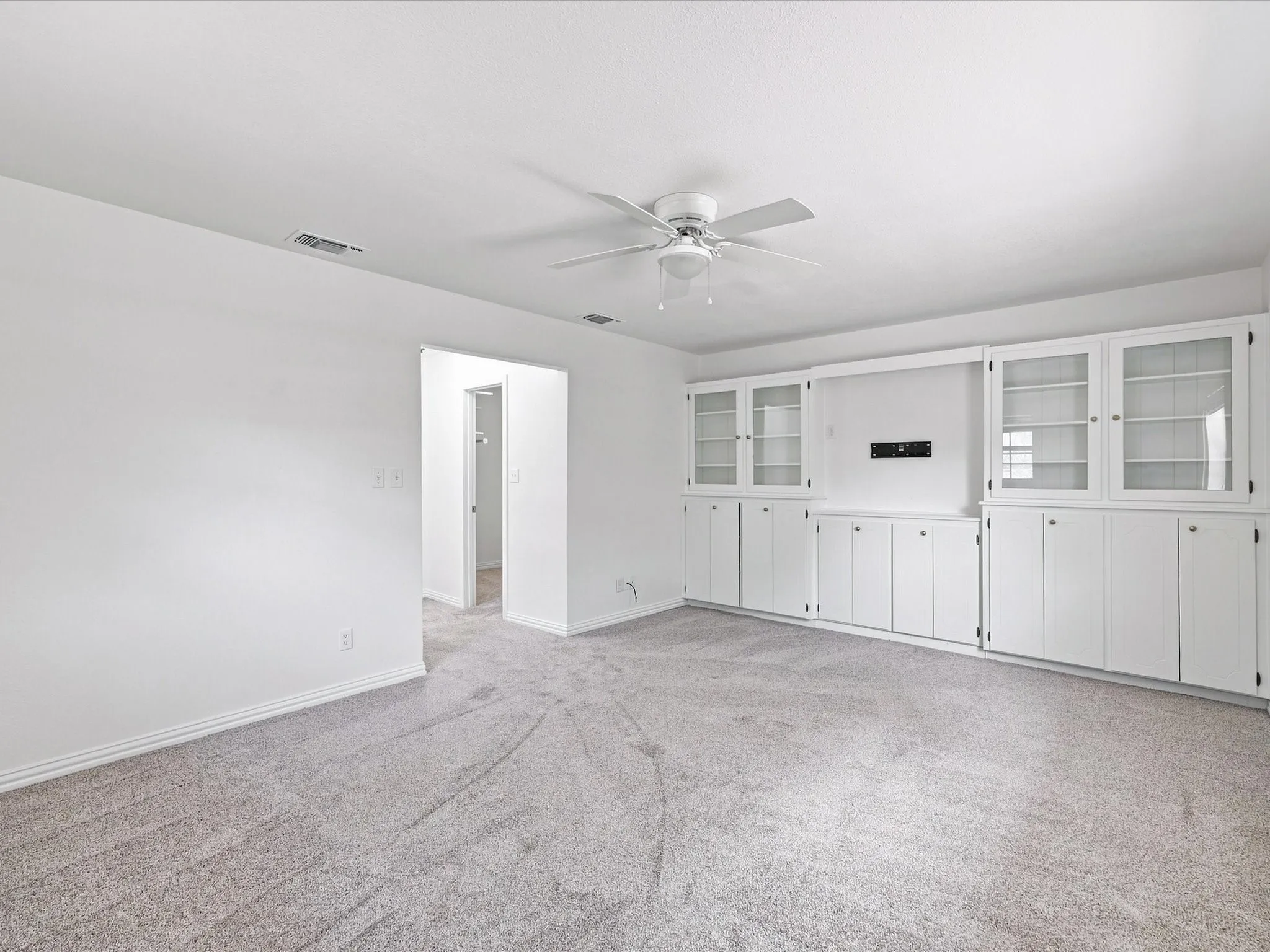 Notice the built-in cabinets with flat screen wiring