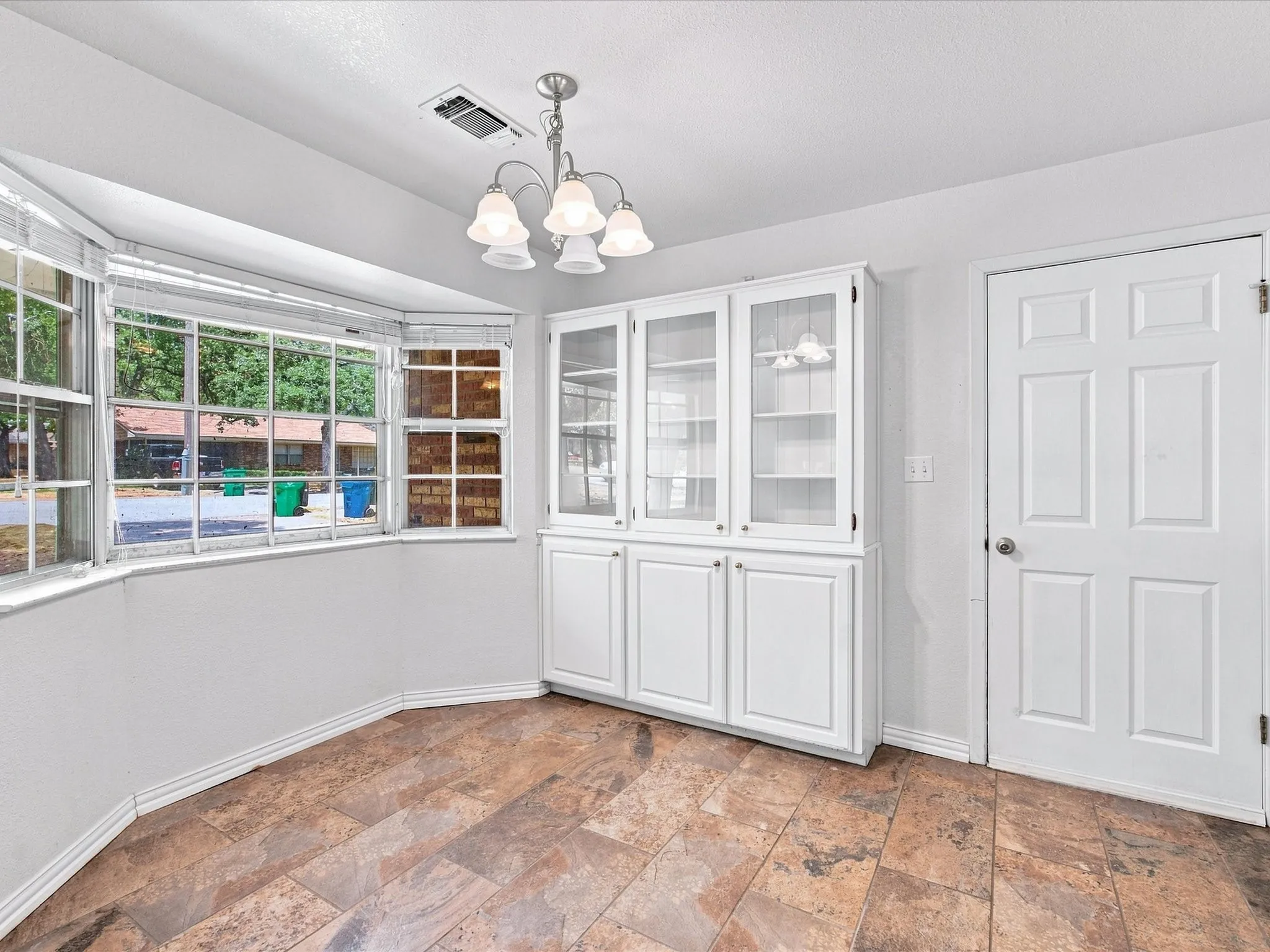Notice the lovely built-ins in the kitchen dining space