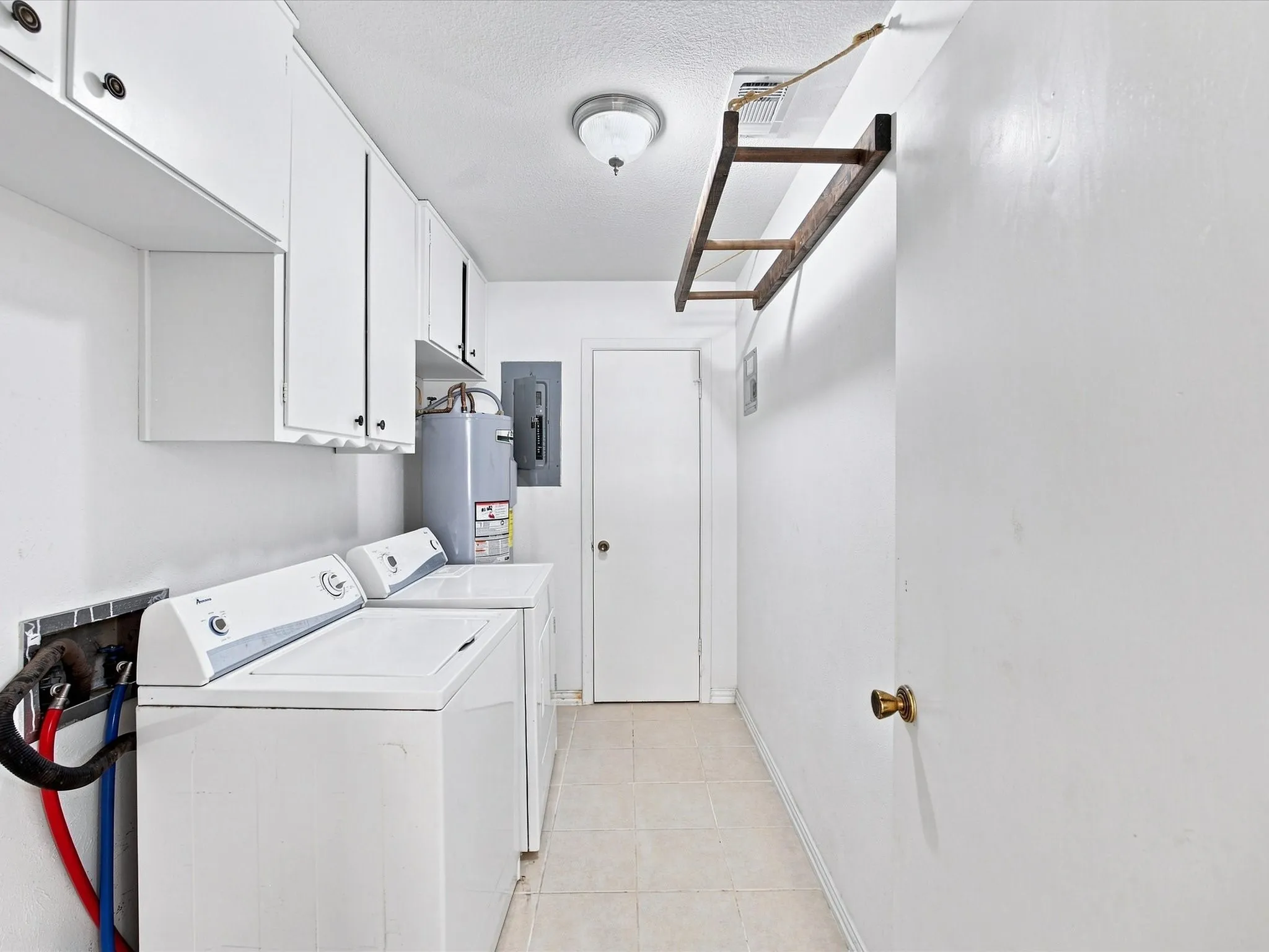 Notice the cabinets and drying rack