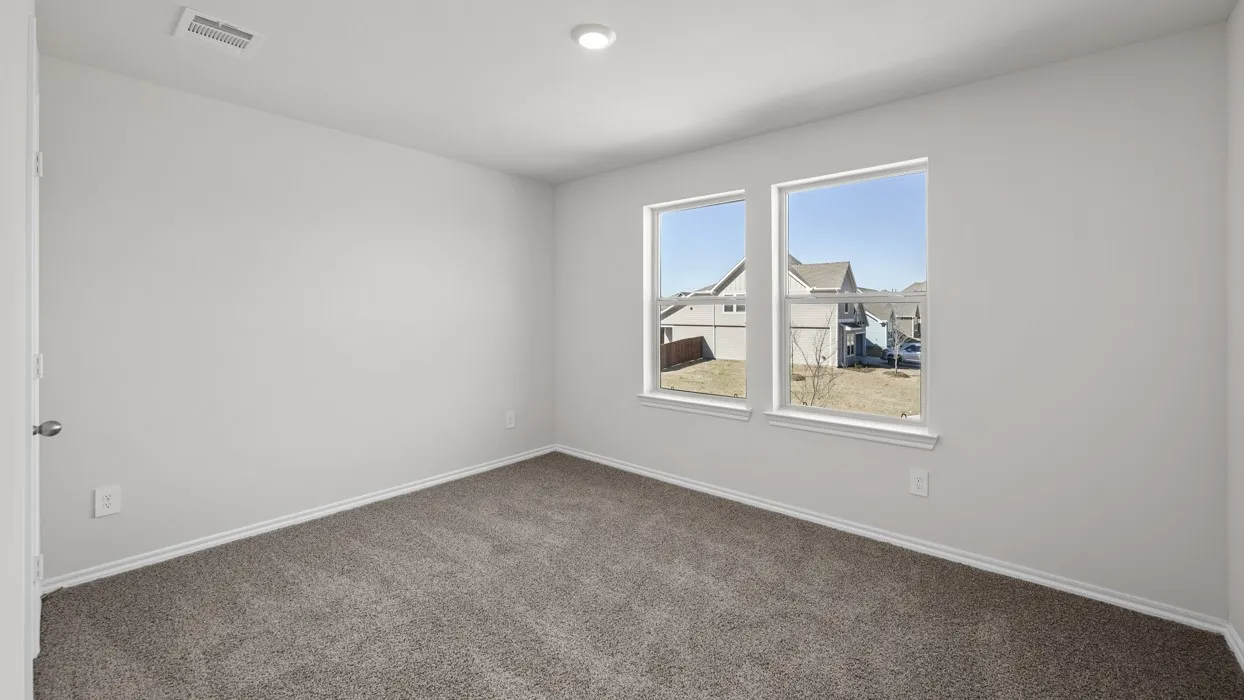 Neutral wall paint, recessed ceiling lighting, light-toned carpet, and two double-hung windows