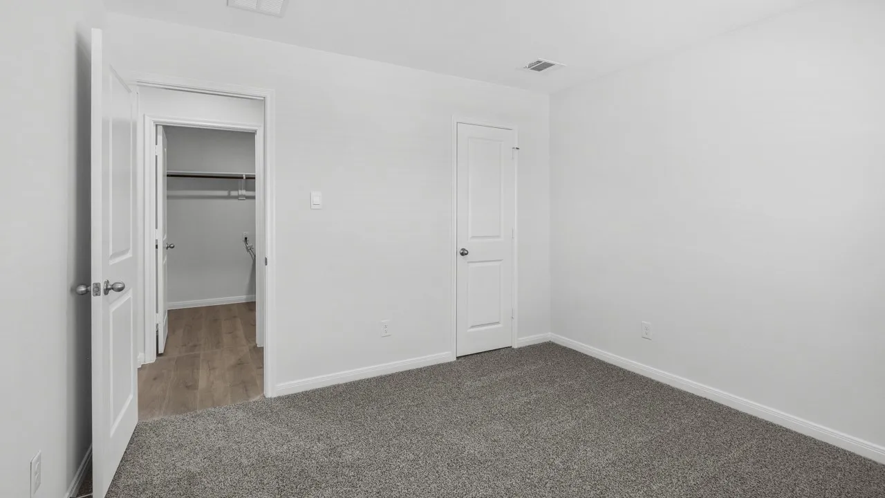 Room featuring grey carpet flooring and white painted walls