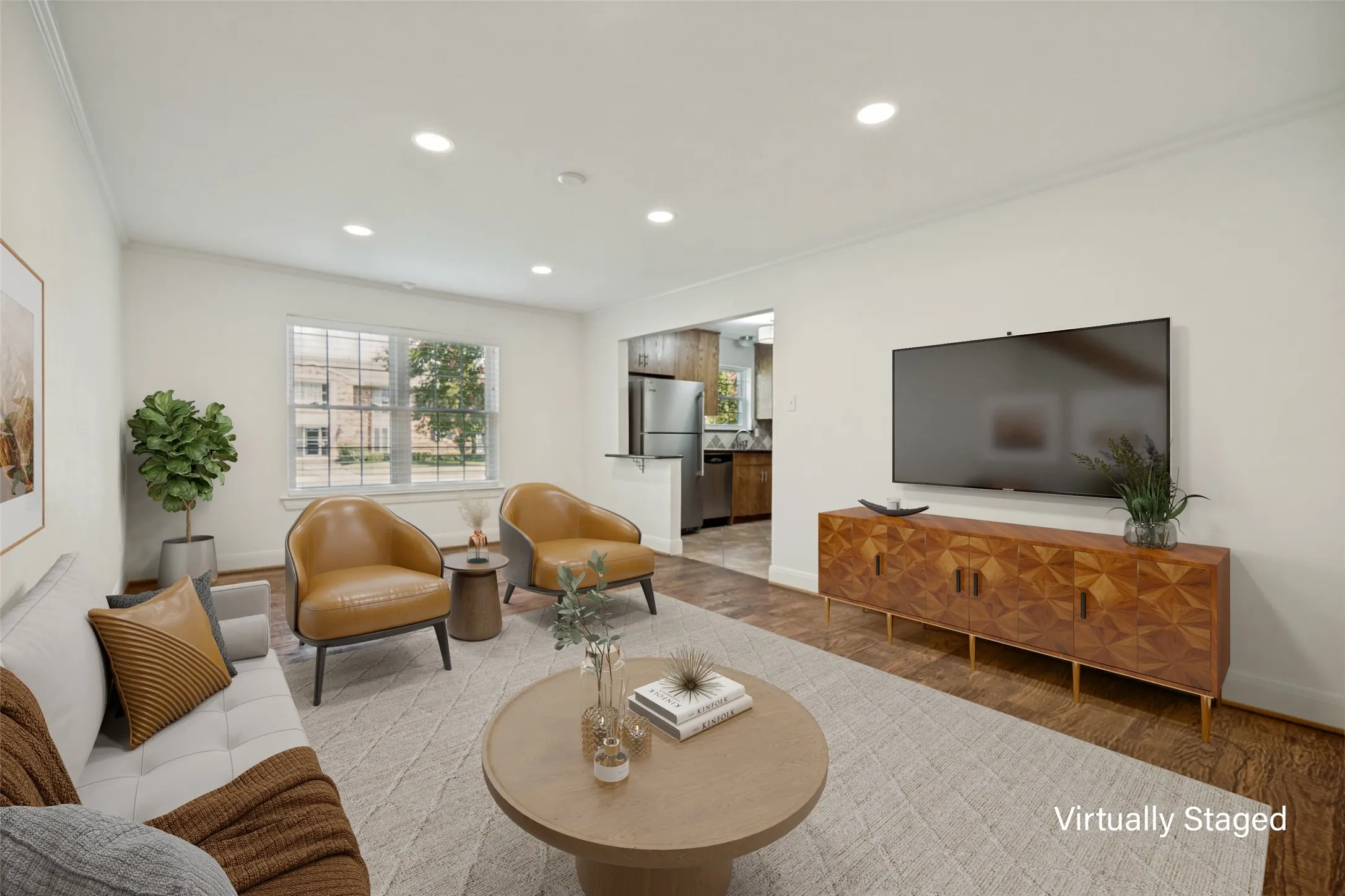 Recessed ceiling lighting, wood-finish flooring, white walls, and a window with natural light
