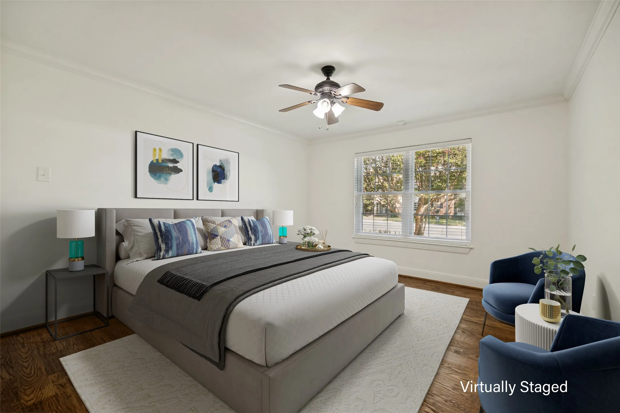 Wood-finish flooring, crown molding, and a ceiling fan with integrated lighting