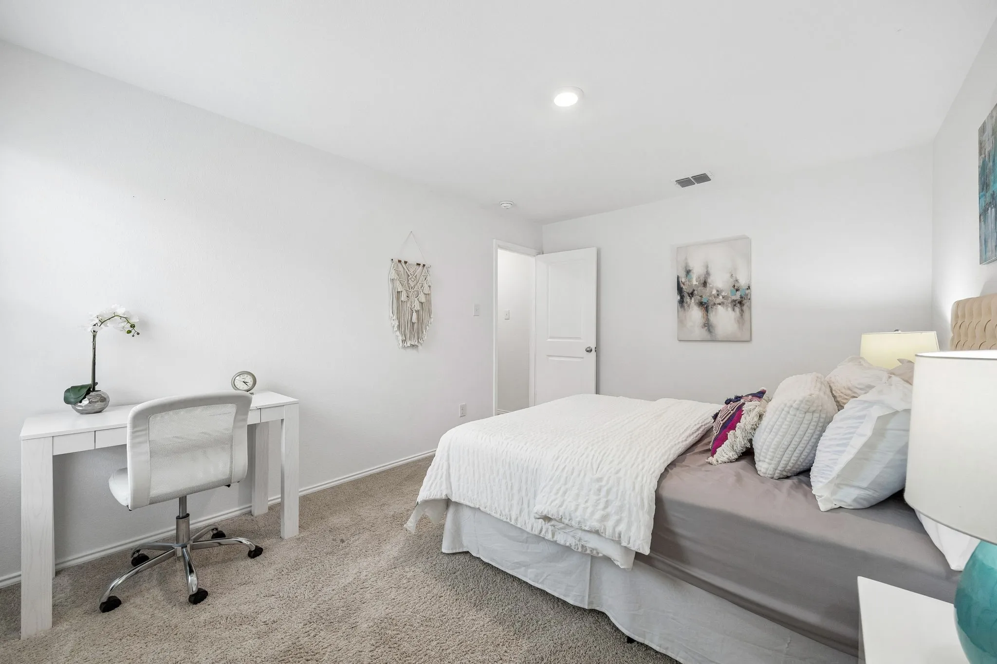 Neutral wall paint, recessed lighting, and carpeted flooring