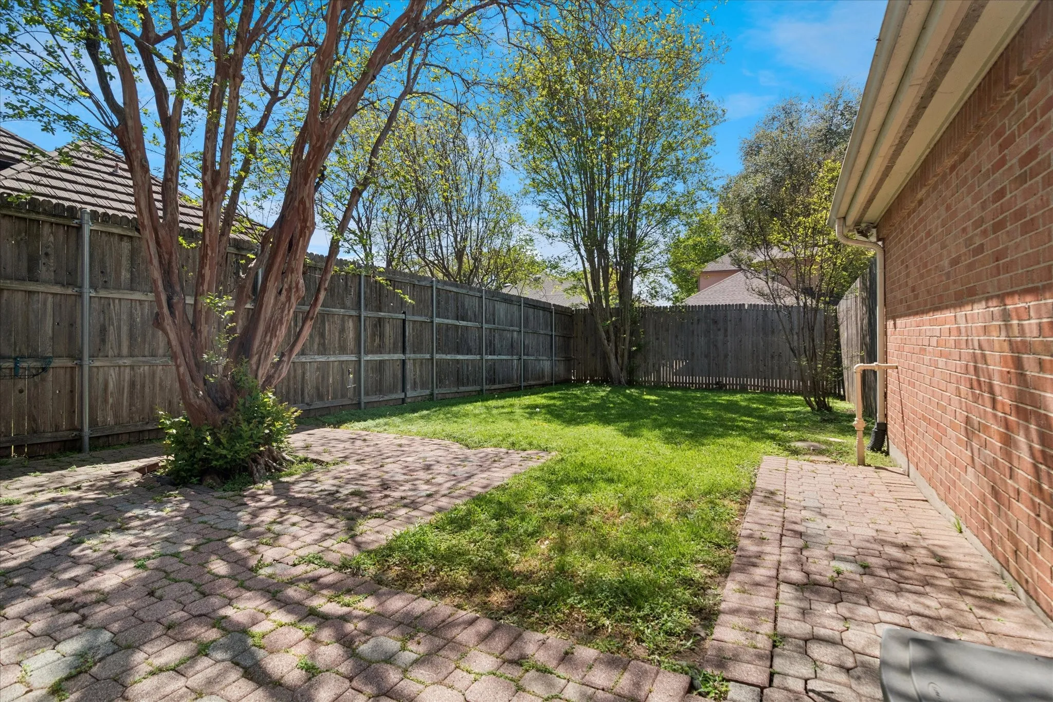 Rear yard large enough for pets or garden.