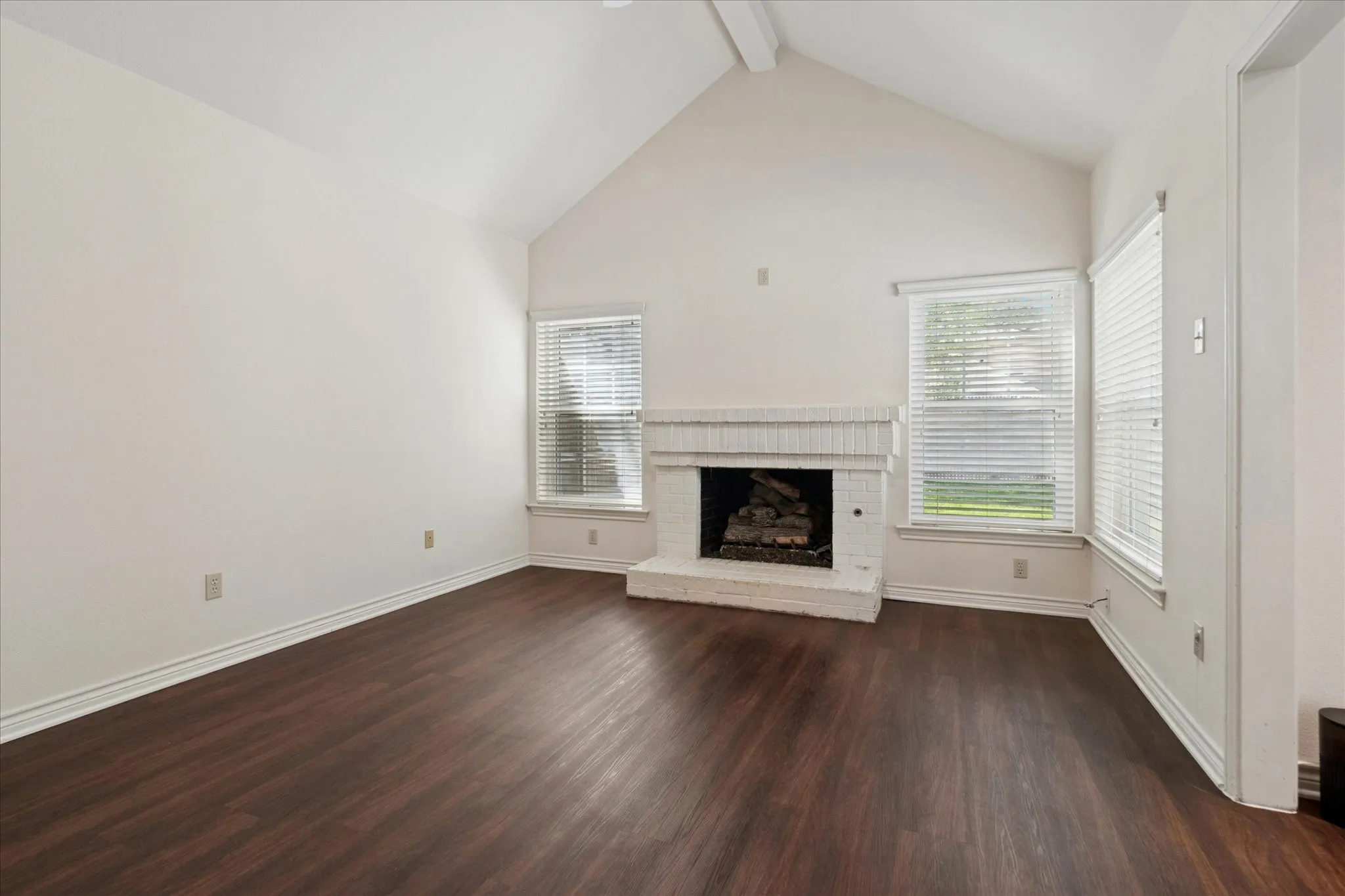 Vaulted ceiling and gas-log fireplace in family room
