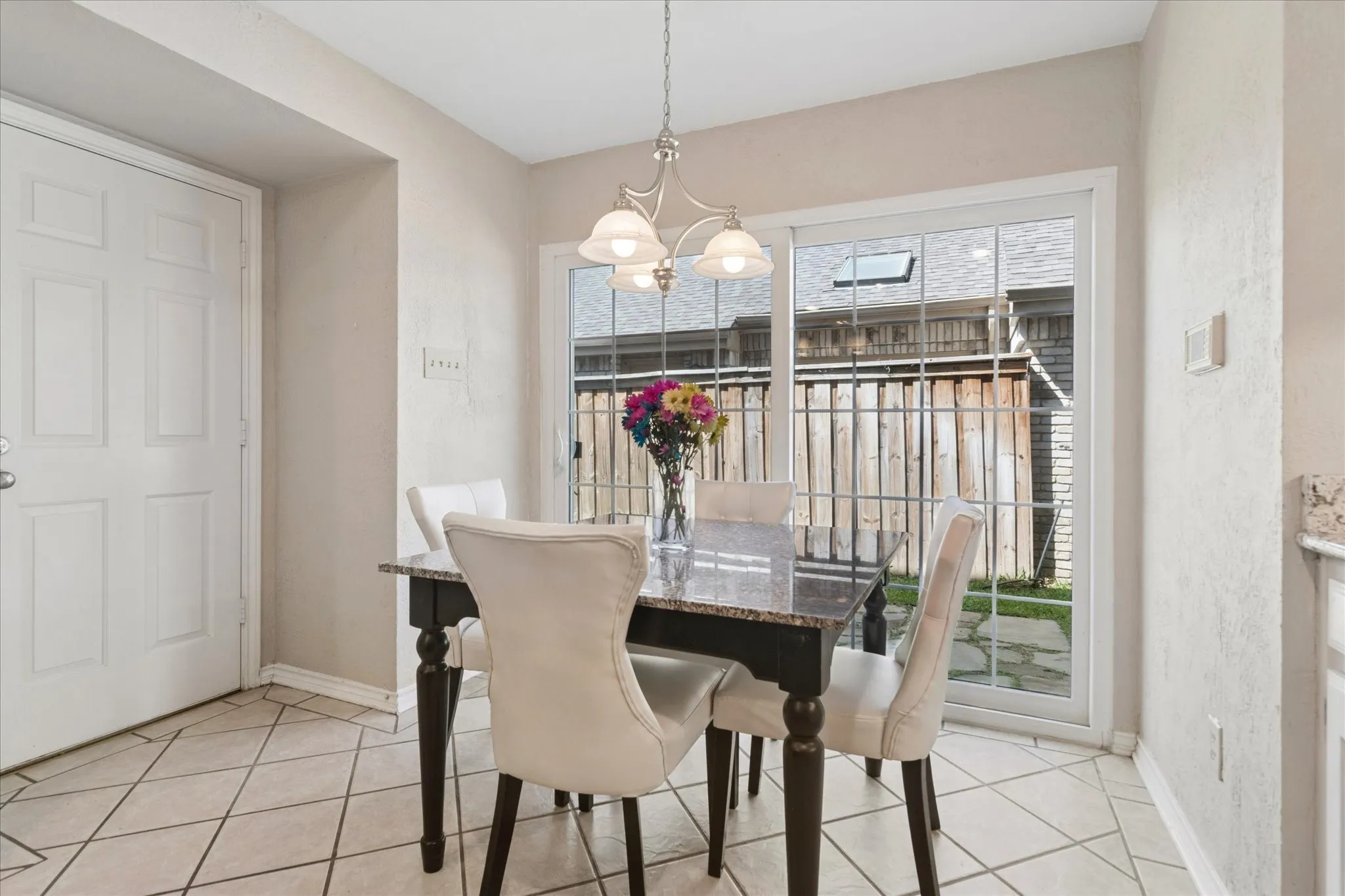 Breakfast area has French doors to small courtyard and another door to garage