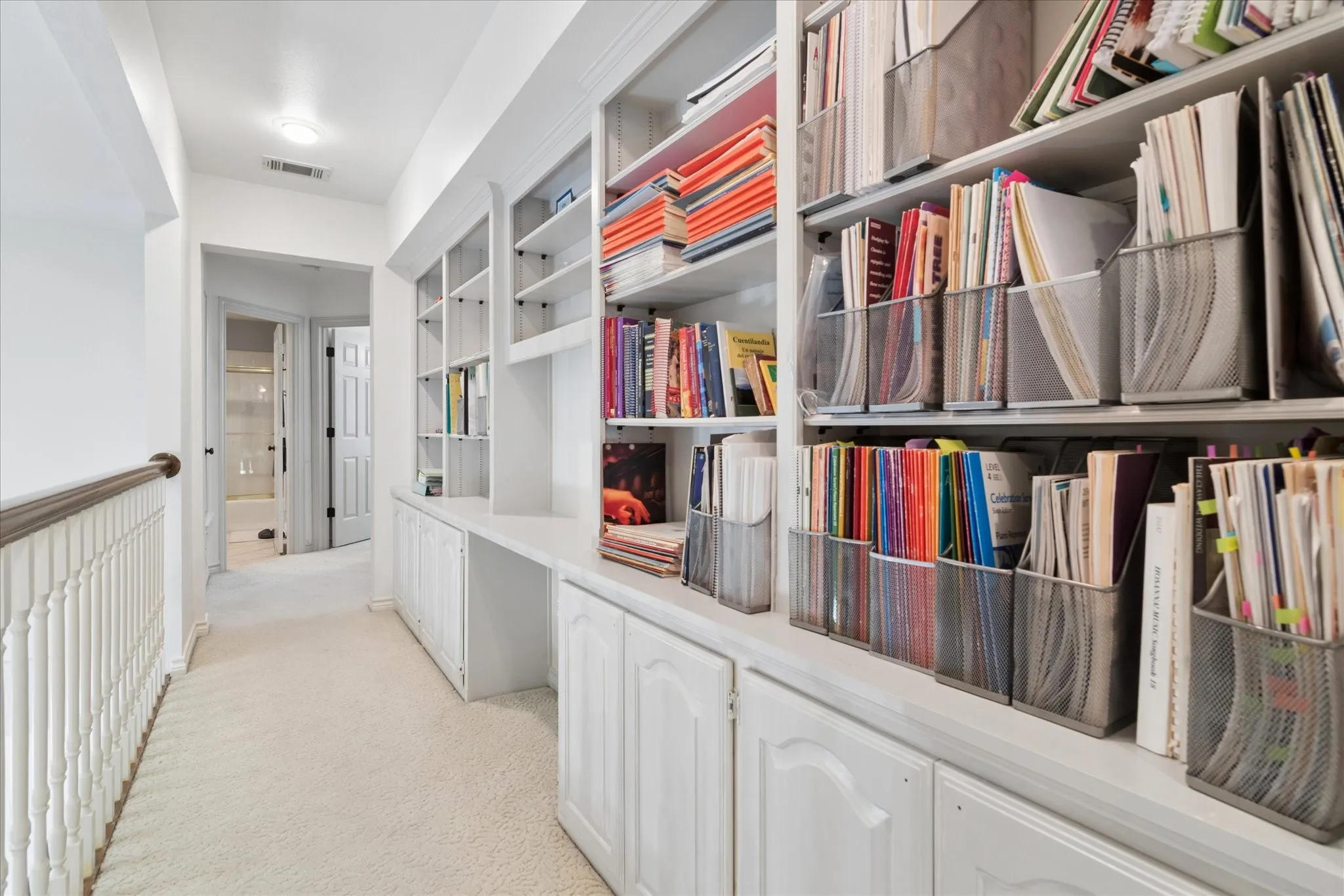 Upstairs loft provides work station and lots of shelves for books or other collectibles