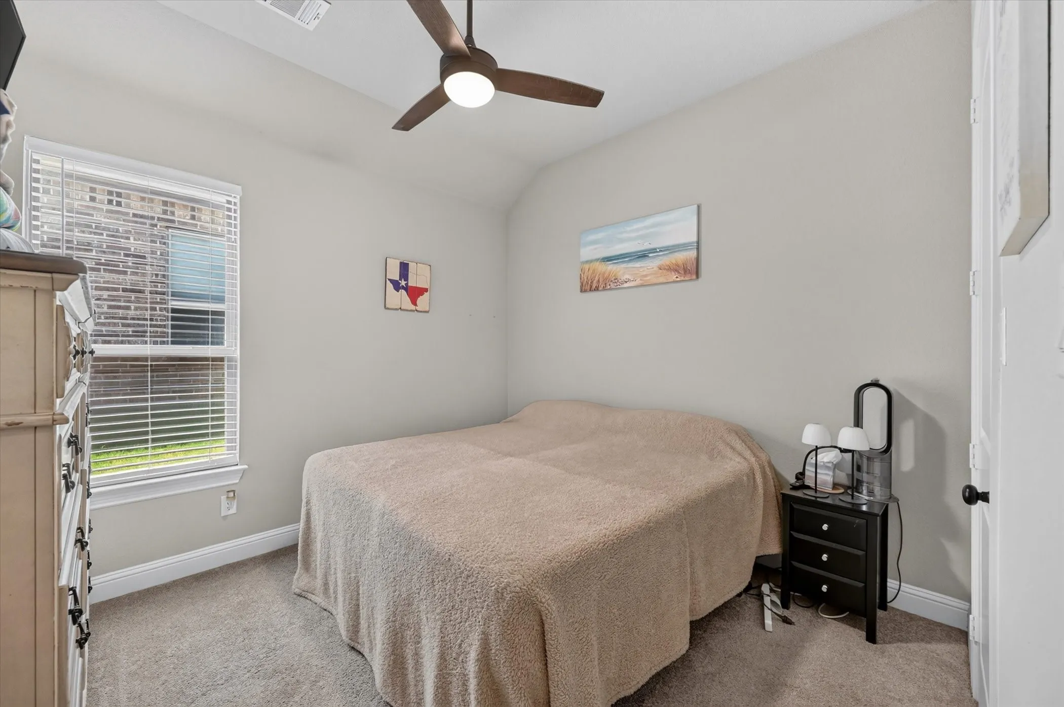 Carpeted room with a ceiling fan, a window featuring blinds, and light-toned wall paint