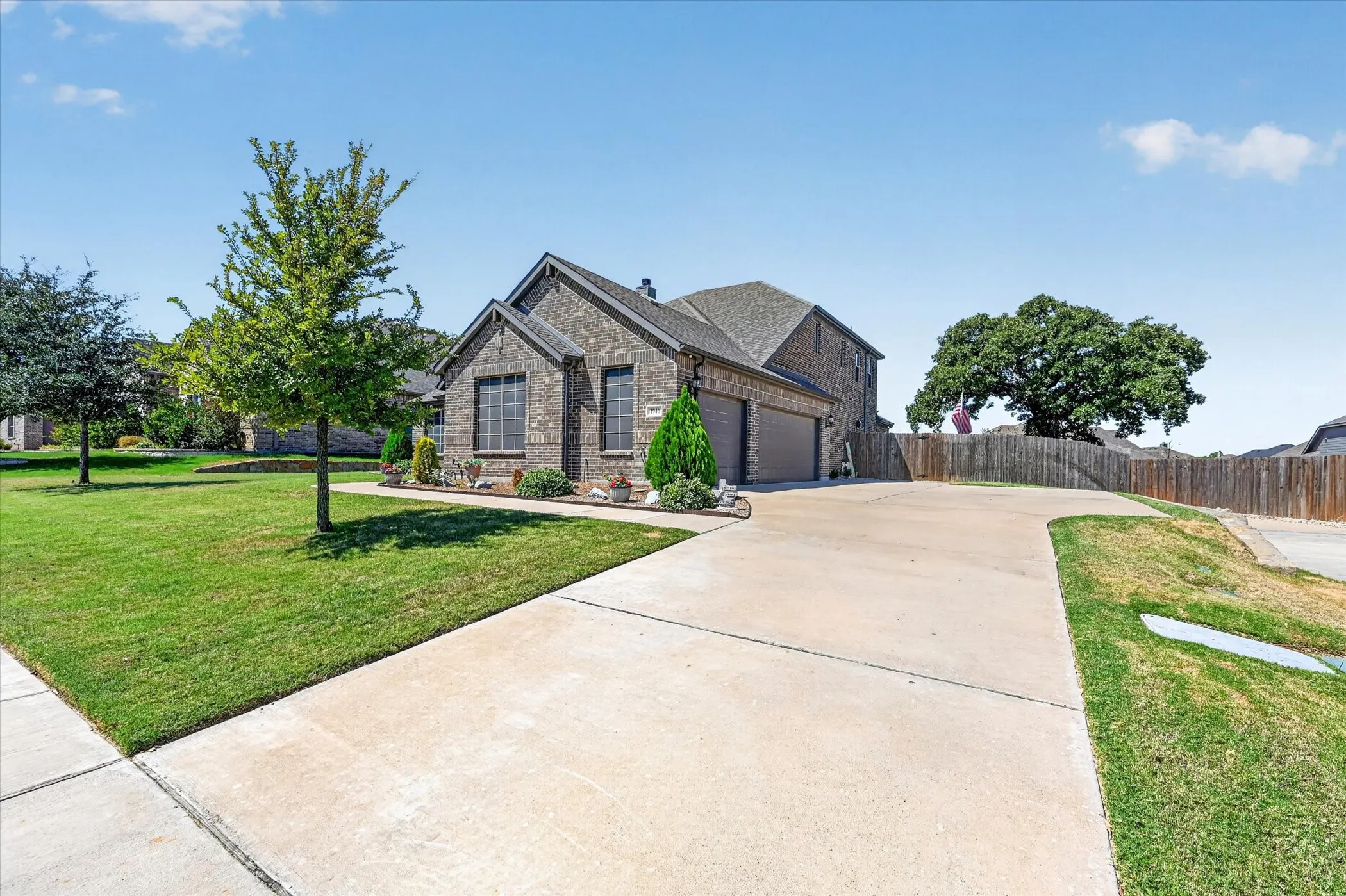 Brick exterior with a gabled roof and attached two-car garage