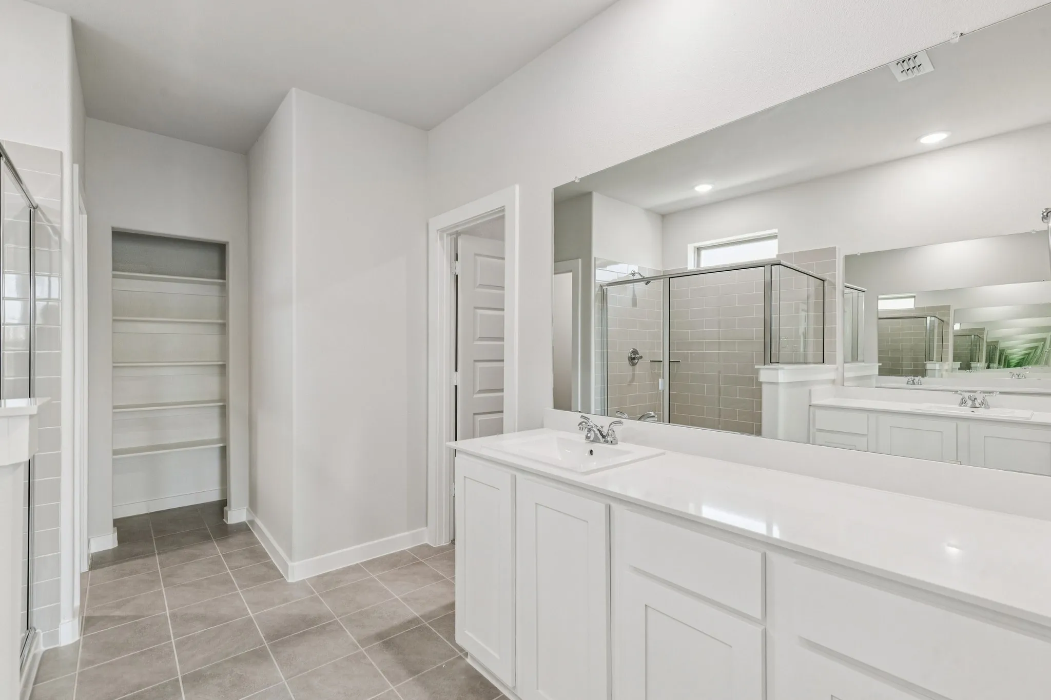 Primary Bathroom in the Winters home plan by Trophy Signature Homes – REPRESENTATIVE PHOTO