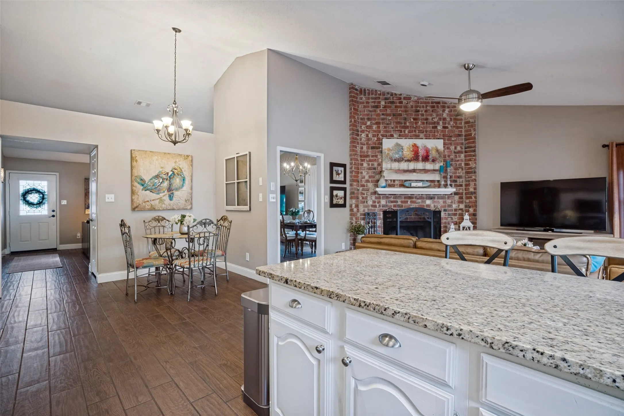 The crisp white cabinets & nickel finish hardware complete the kitchen.
