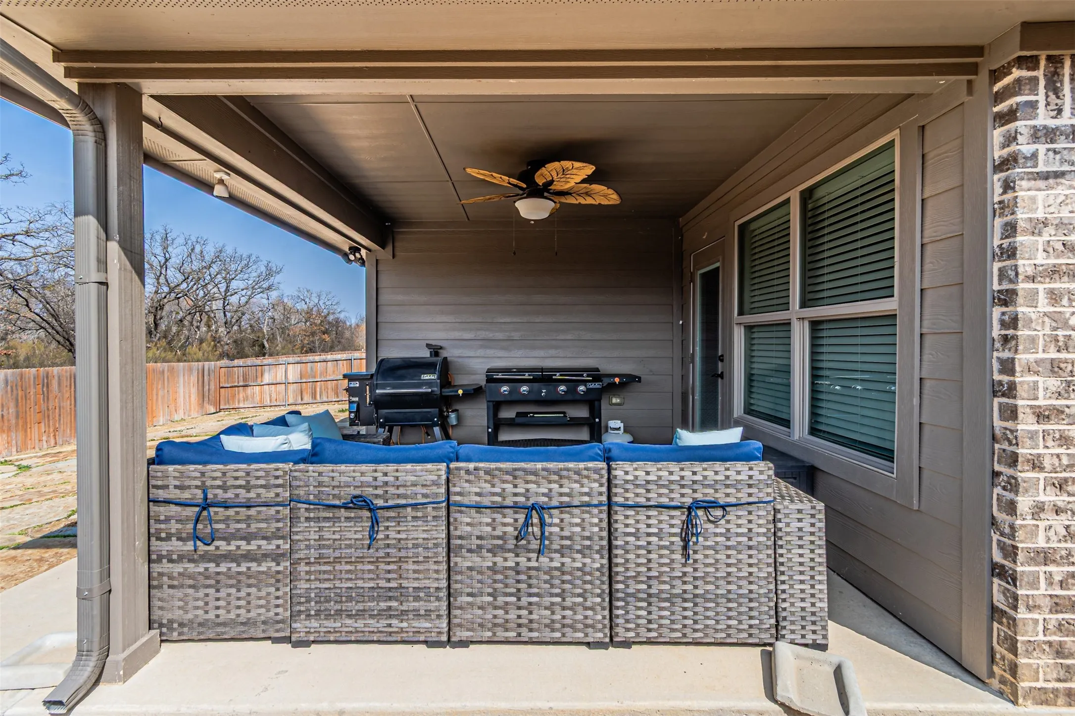 View of patio / terrace featuring outdoor furniture, ceiling fan, and grilling area