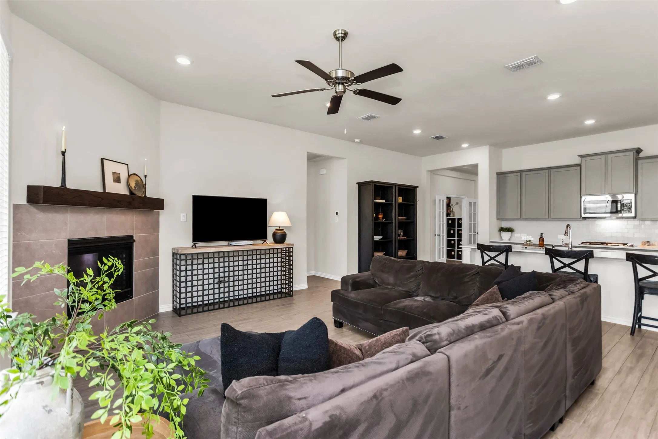 Fireplace with tile surround and wood mantel