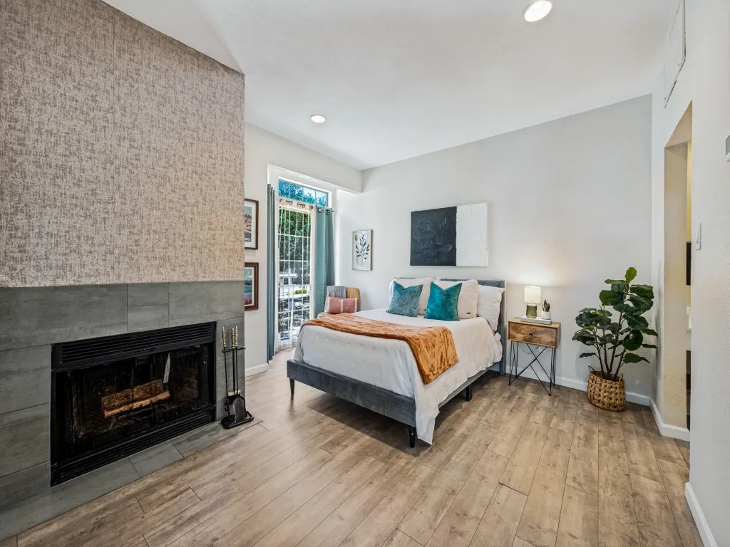 Textured accent wall with a tiled fireplace
