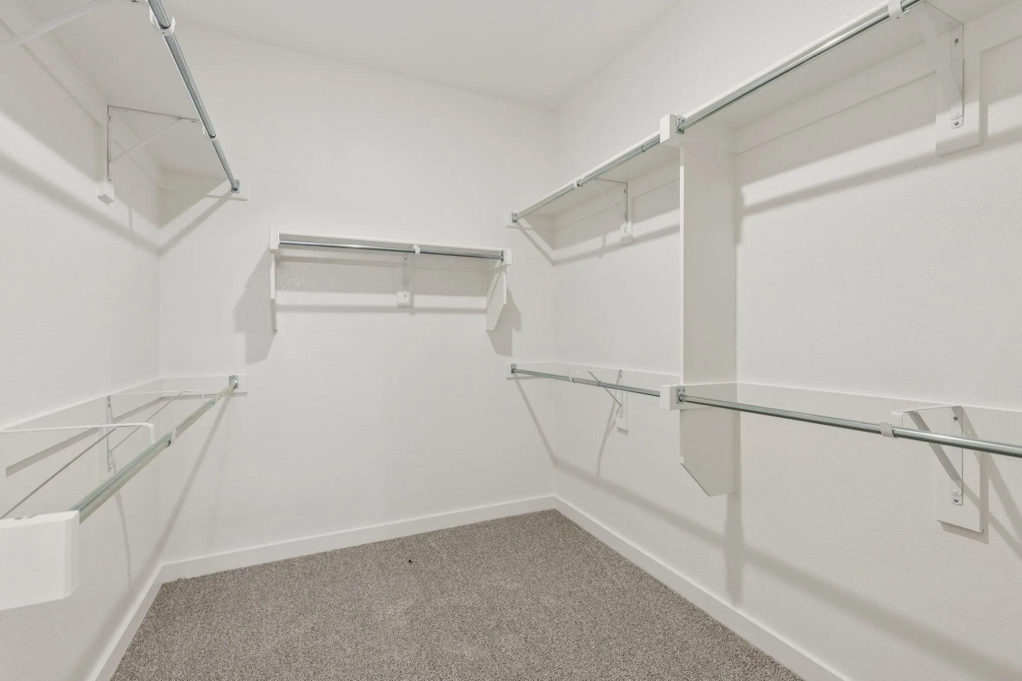 Primary Closet in the Masters home plan by Trophy Signature Homes – REPRESENTATIVE PHOTO