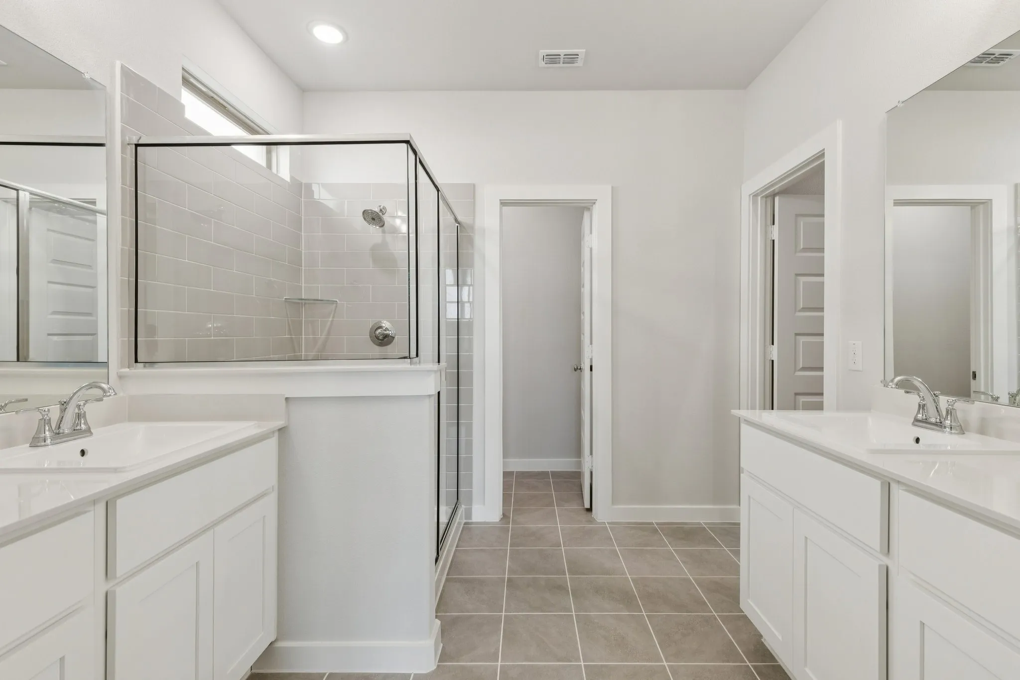 Primary Bathroom in the Masters home plan by Trophy Signature Homes – REPRESENTATIVE PHOTO