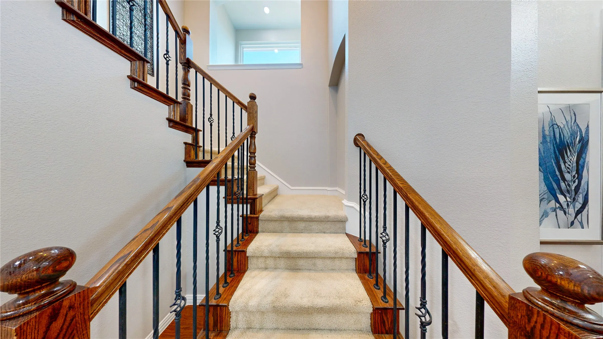Stairs with wrought iron balusters.
