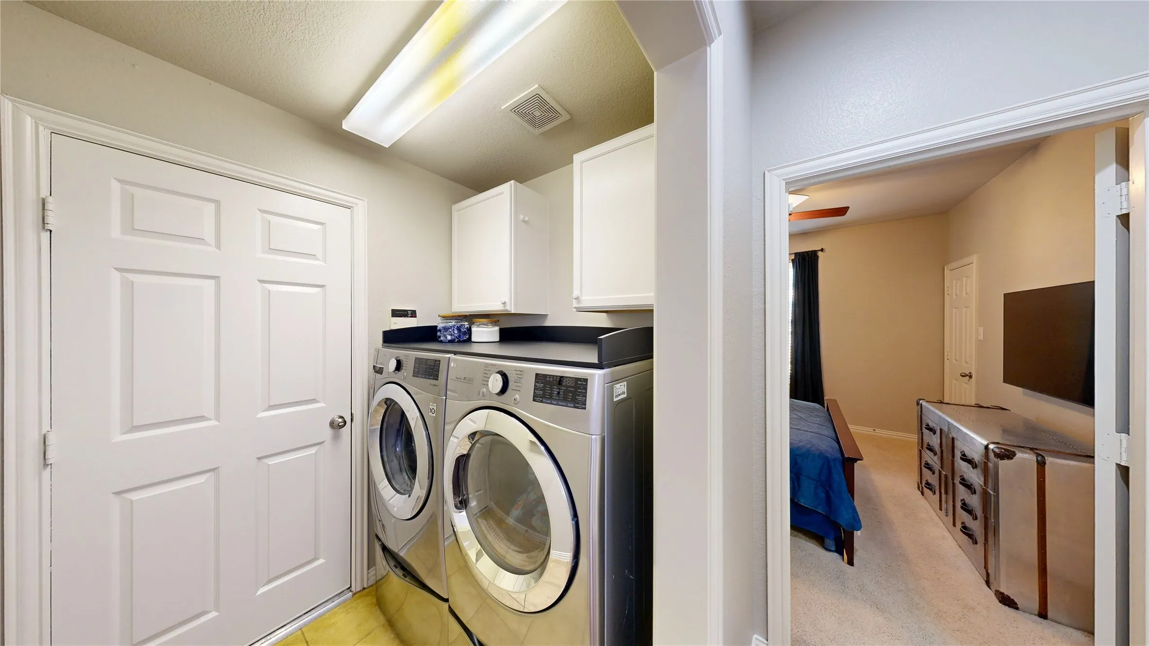 Utility room with built-in cabinets