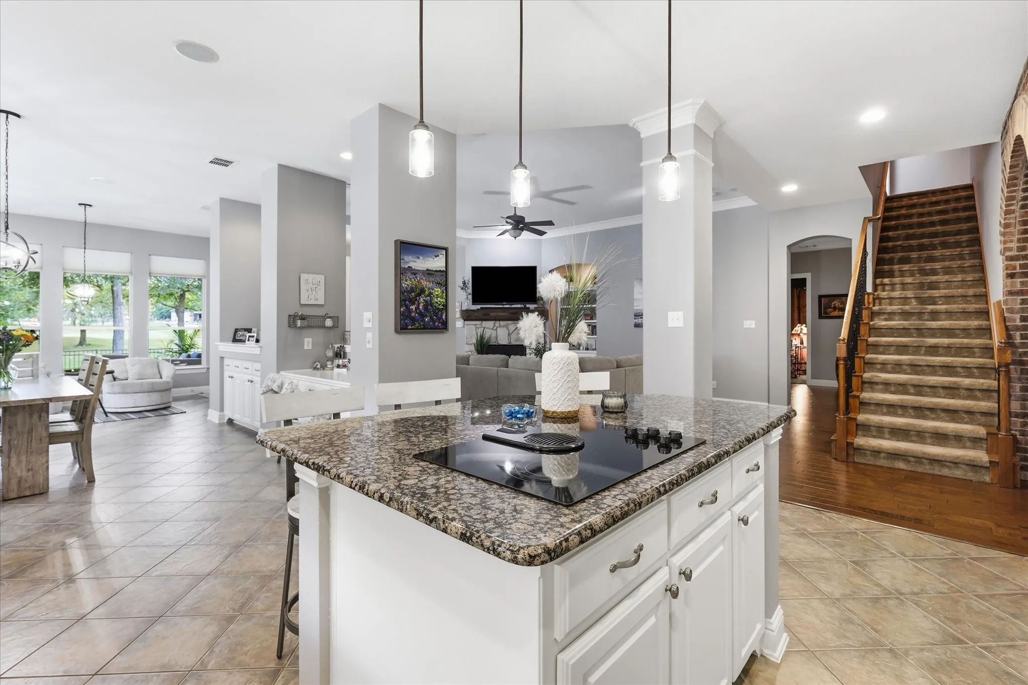 The kitchen truly lives at the center of the home, with an oversized island and open sightlines that keep everyone connected. Gas stub is already in place under the island for anyone who prefers gas cooking.