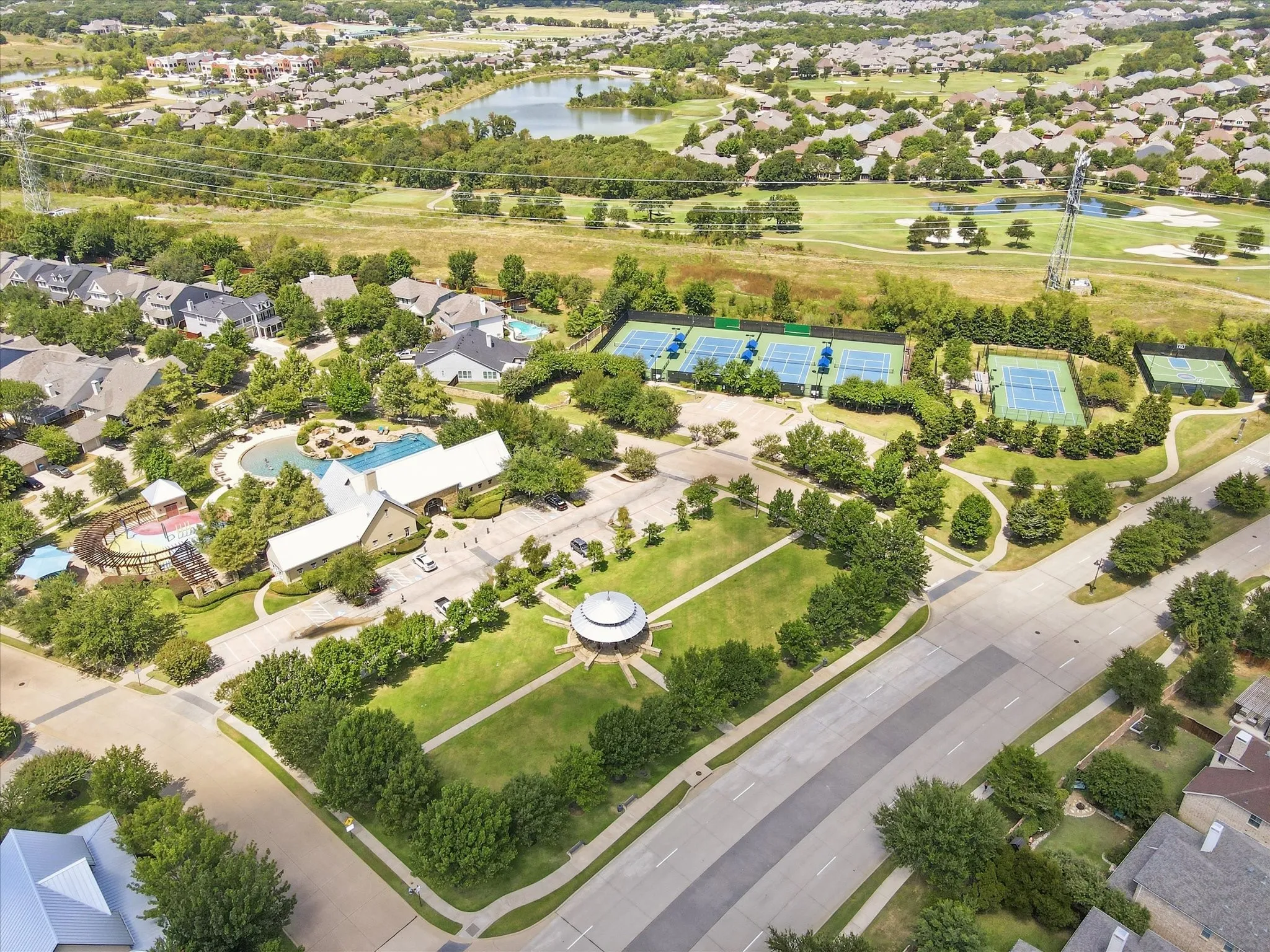 Live the lifestyle — exceptional neighborhood amenities including tennis courts, green space, and resort-style recreation just moments away.