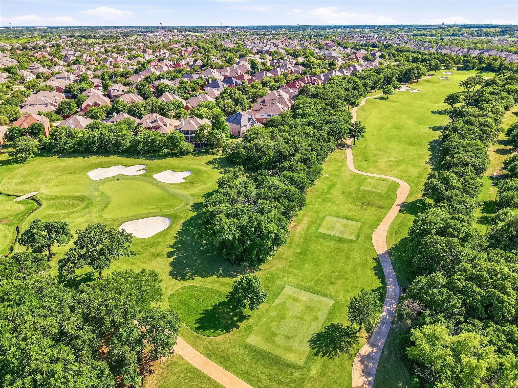 A breathtaking aerial look at the beautifully maintained course that creates the scenic backdrop for this special property.