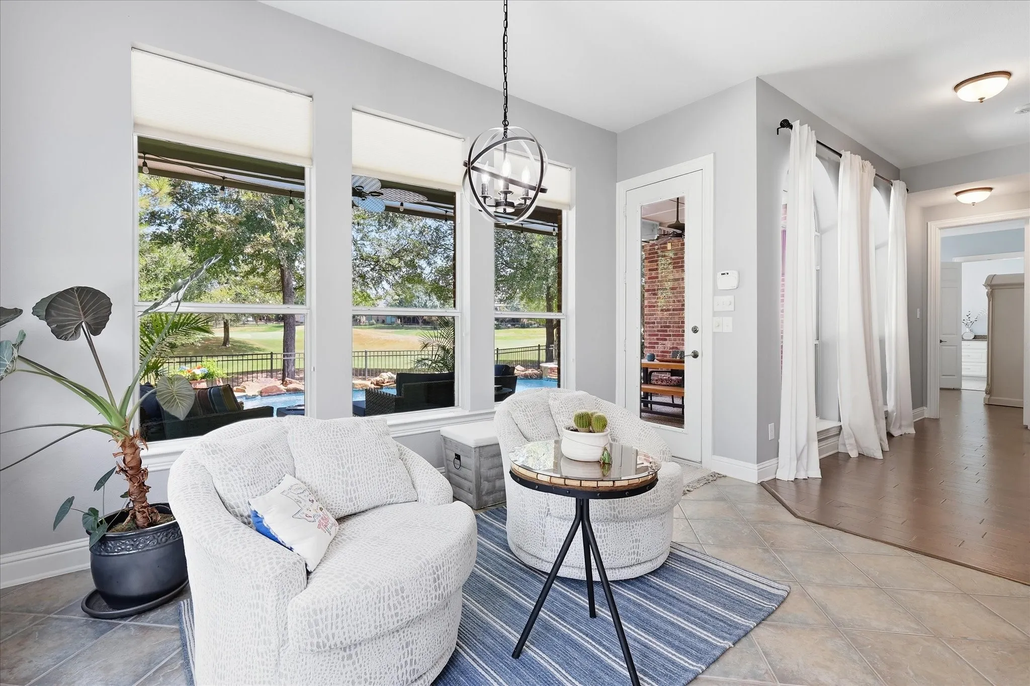 One of those spaces you’ll use every day — a light-filled sitting nook surrounded by windows and peaceful backyard views.