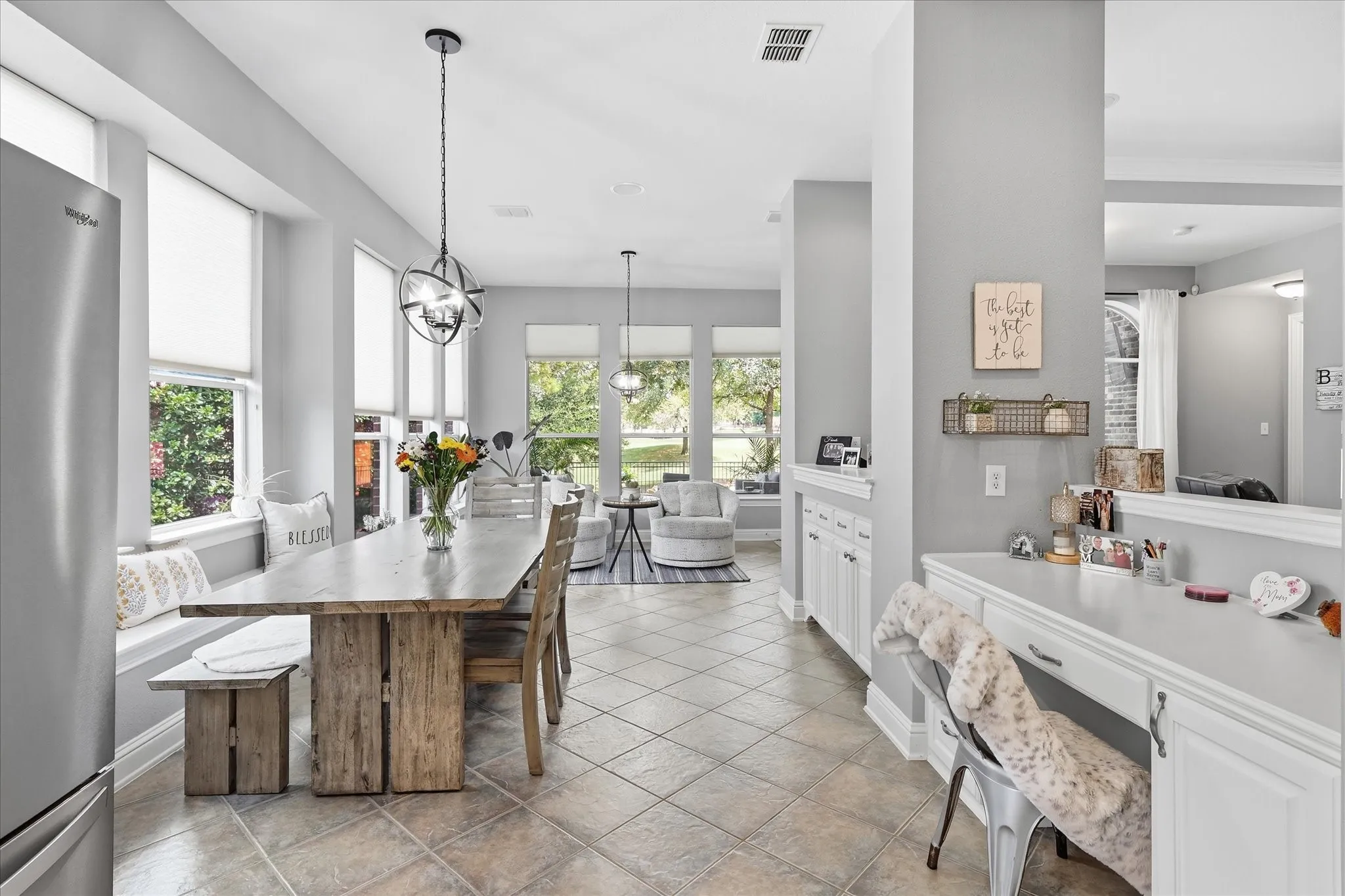Sunshine pours into this cheerful breakfast area, creating the perfect spot for slow mornings, family meals, or coffee with a view.