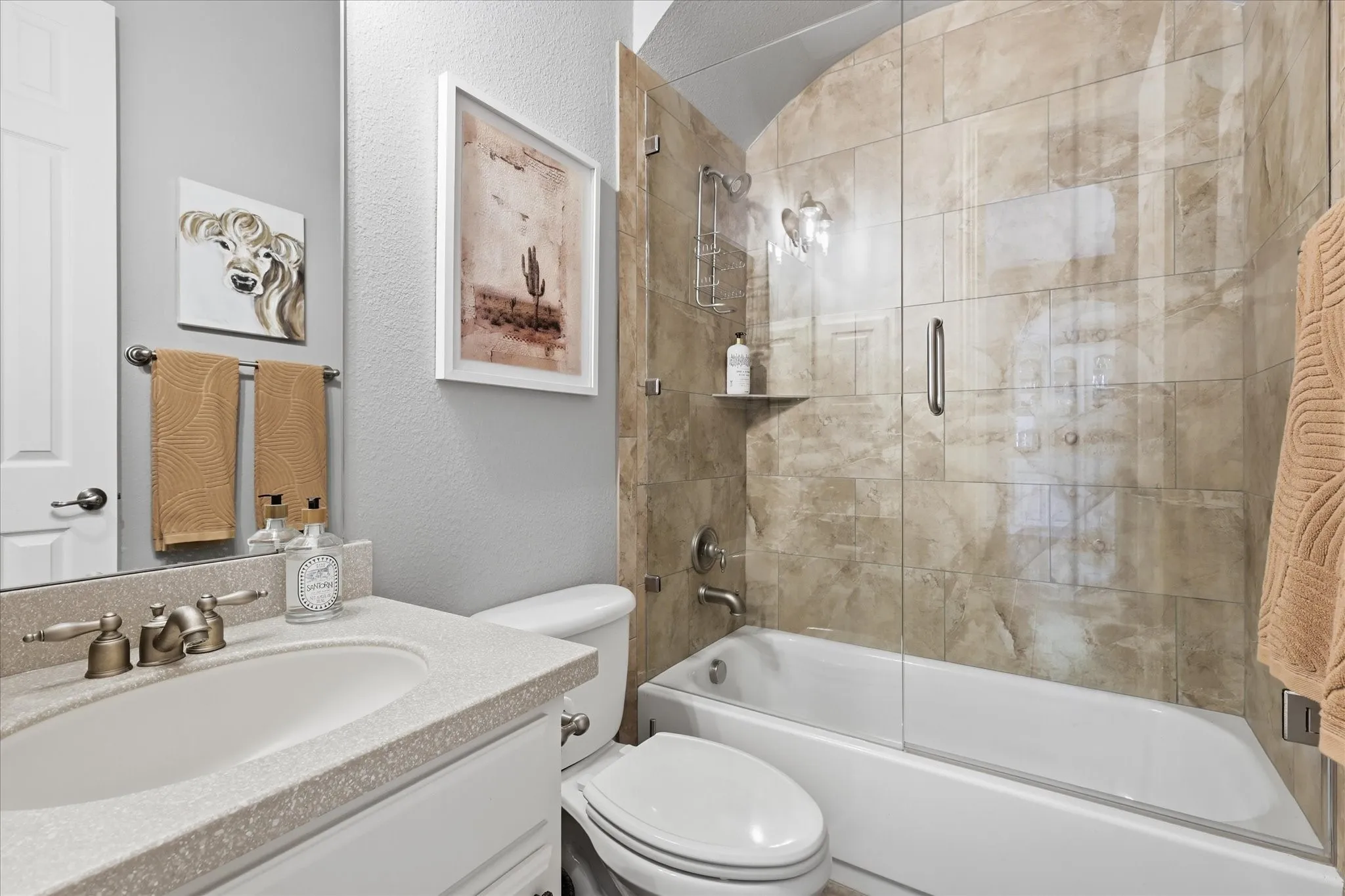 Clean, stylish, and move-in ready, this full bath features timeless finishes and a beautifully tiled tub/shower surround.