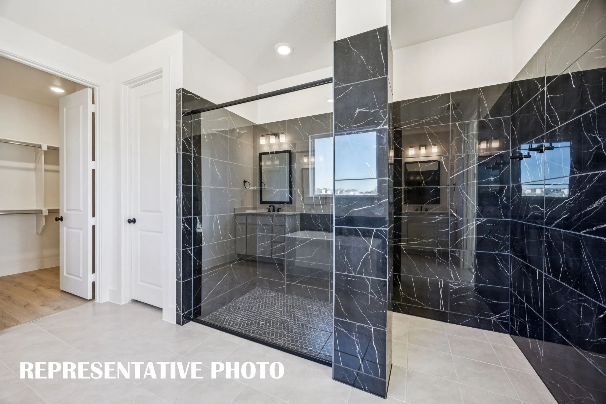 You'll enjoy a spa like experience every day in the spacious owner's bath with
walk in shower! REPRESENTATIVE PHOTO
