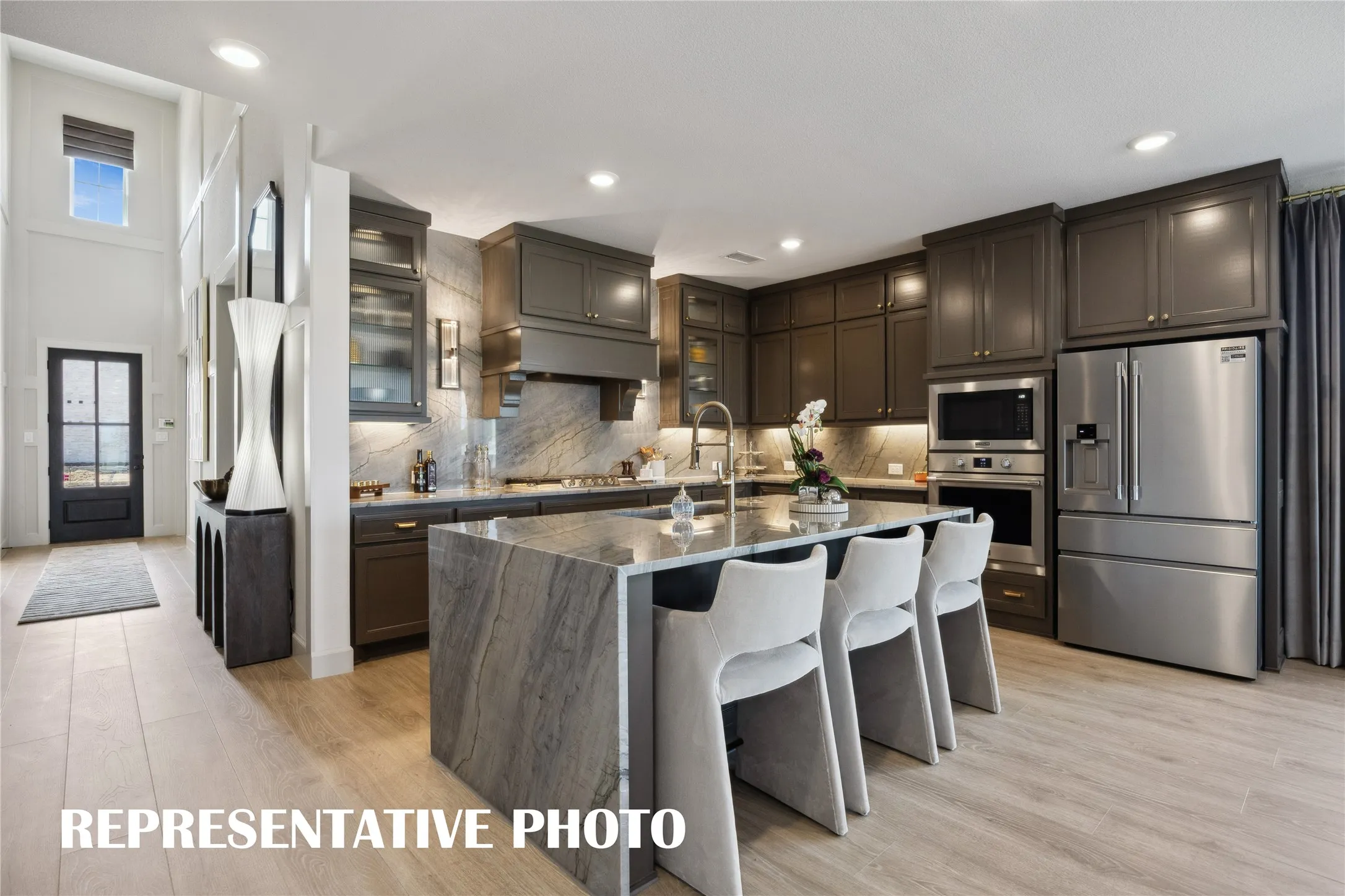 Featuring outstanding storage and prep space, the chef in the family will fall in love with this dream kitchen!  REPRESENTATIVE PHOTO