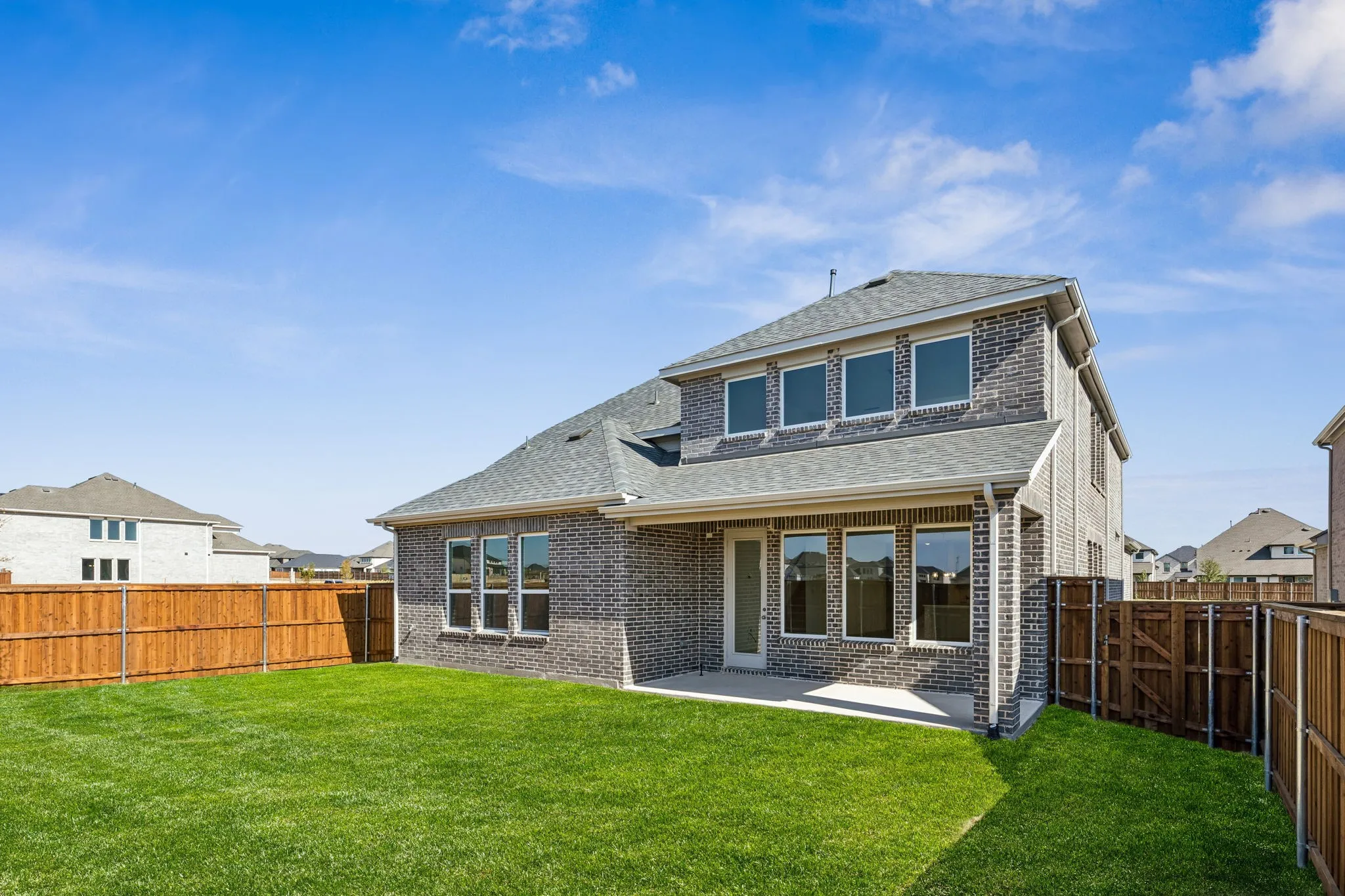 Plenty of summertime fun to be had by all in this wonderful fenced backyard with covered back patio!