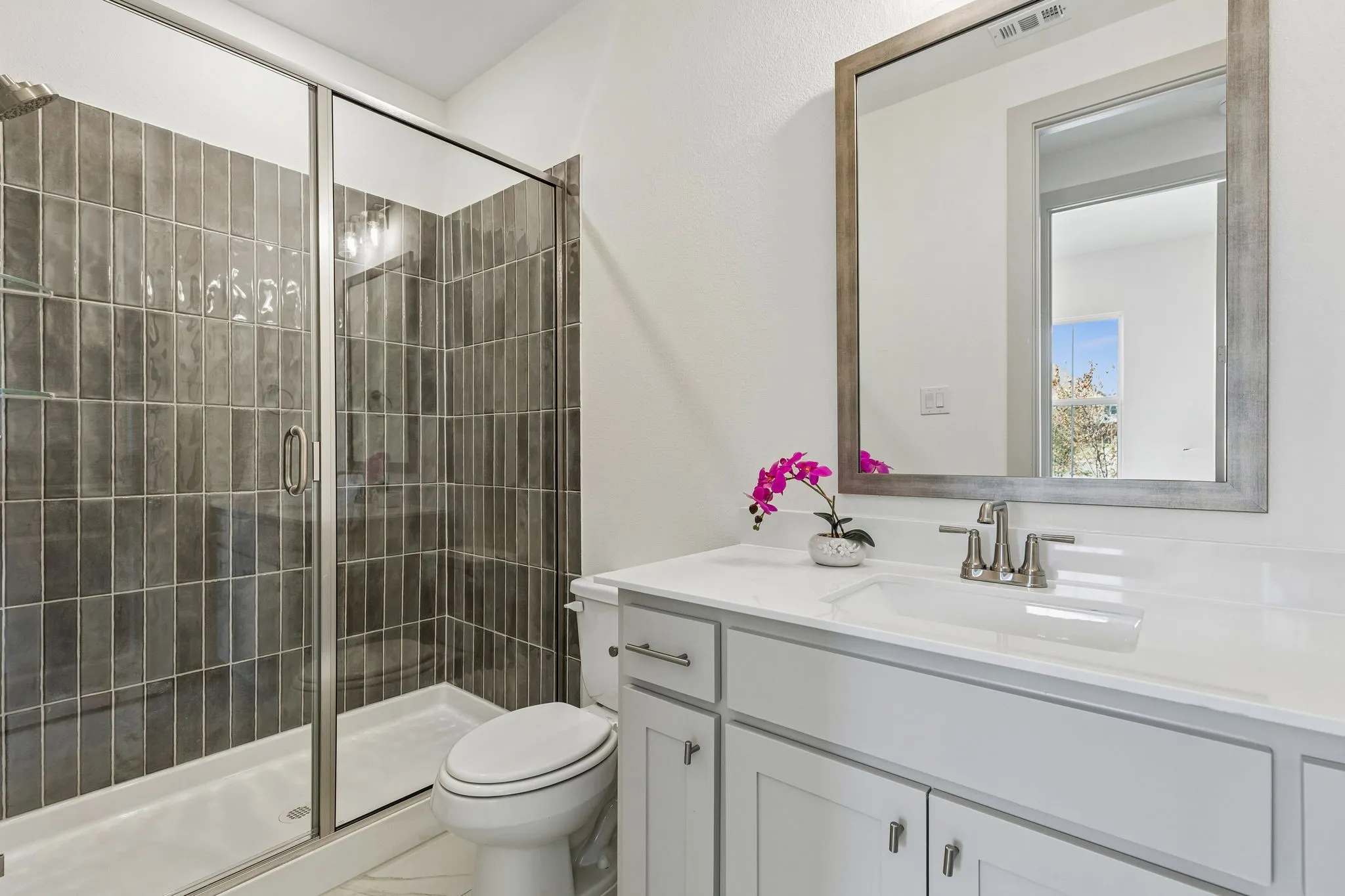 Friends and family will love the beautiful guest baths in this lovely home.