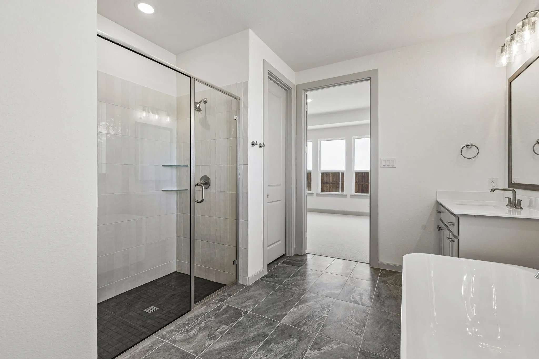 Whether it's soaking your cares away in the freestanding tub or indulging in a long, luxurious shower, you'll enjoy a spa like experience every day in this wonderful owner's bath!
