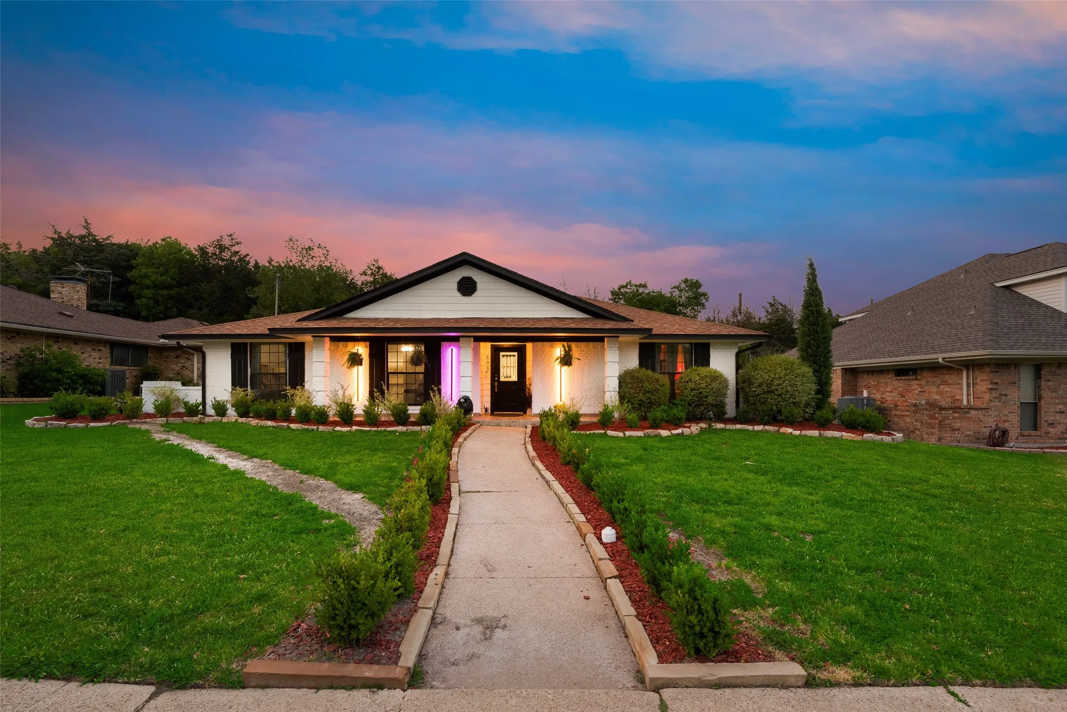 Single story home featuring a yard and a porch