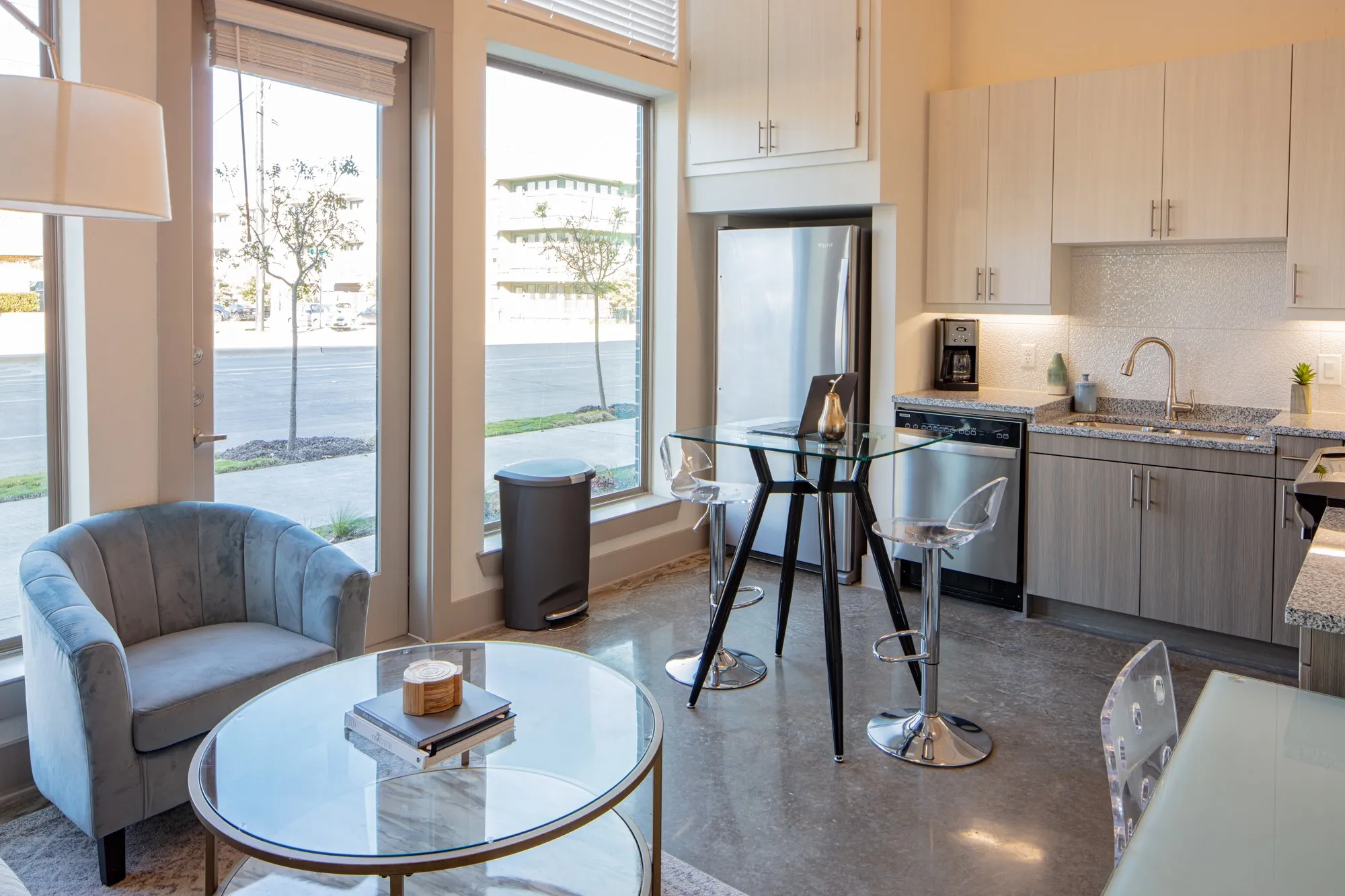 Kitchen featuring backsplash, sink, stainless steel appliances, and plenty of natural light