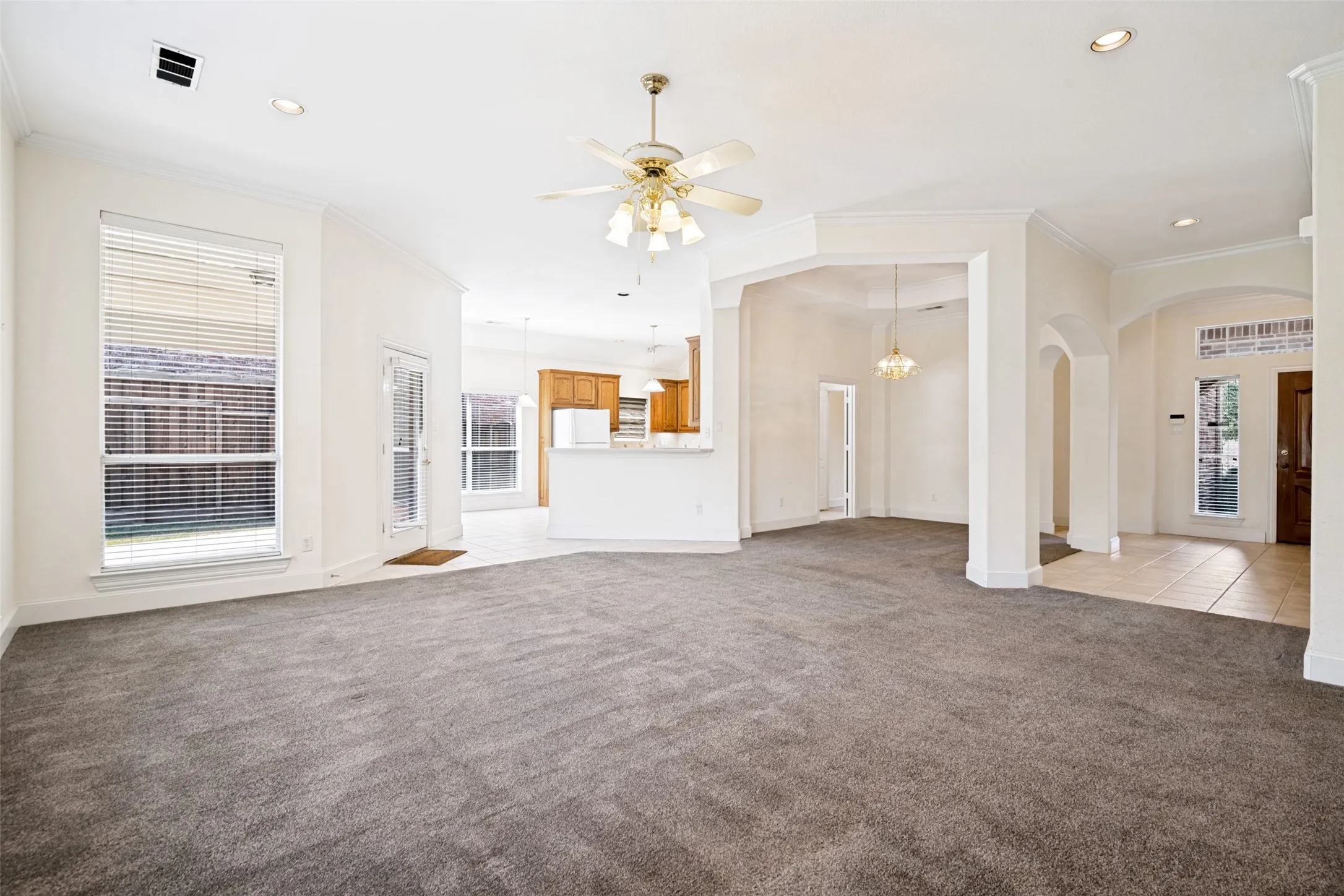 The flow of this spacious home makes it a great place to call home and come together for memorable family events. Two spacious eating areas, a view of the backyard, lovely deep baseboards and crown molding, and arched entries make this a breathtaking home.