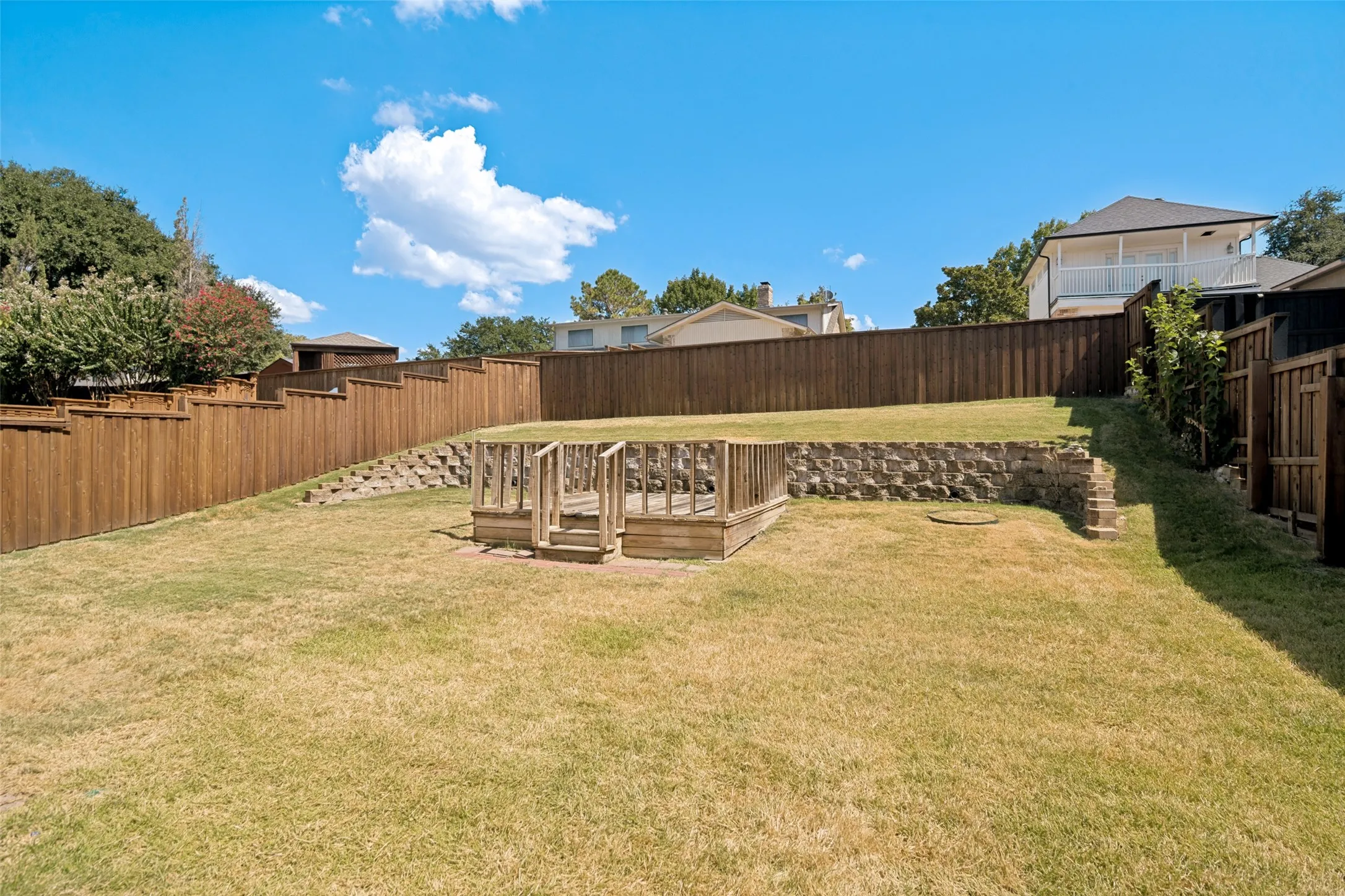 Enjoy the lovely private backyard with the custom board on board stained fence, beautiful retainer wall and deck area for your evenings outdoors enjoying spending time with your family and friends.