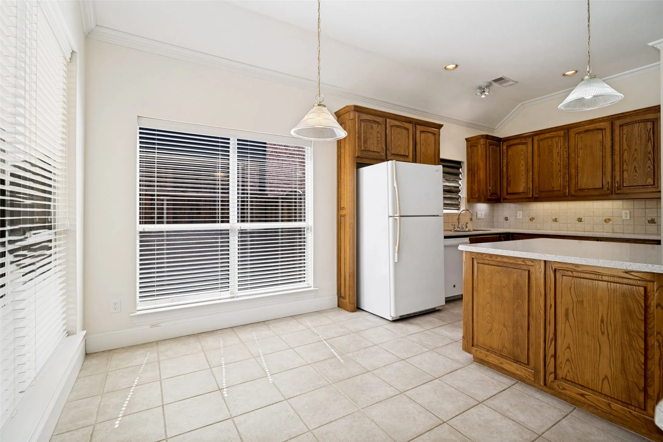 The breakfast nook has a view of the backyard. Perfect for enjoying your family mealtime.